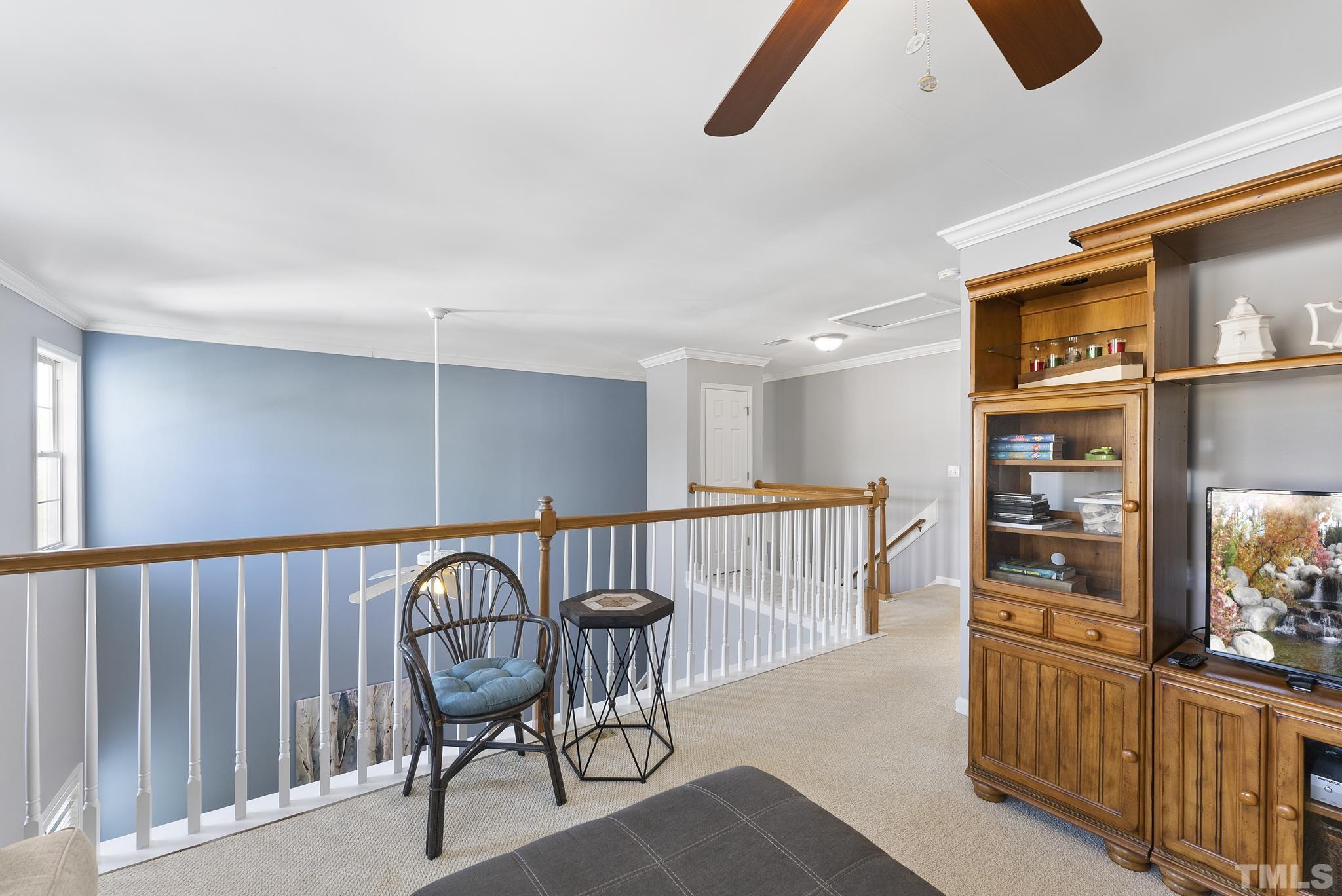 5016 Village Lawn Drive Raleigh, NC 27613 - Photo 14 of 27 a view of a hallway with seating area