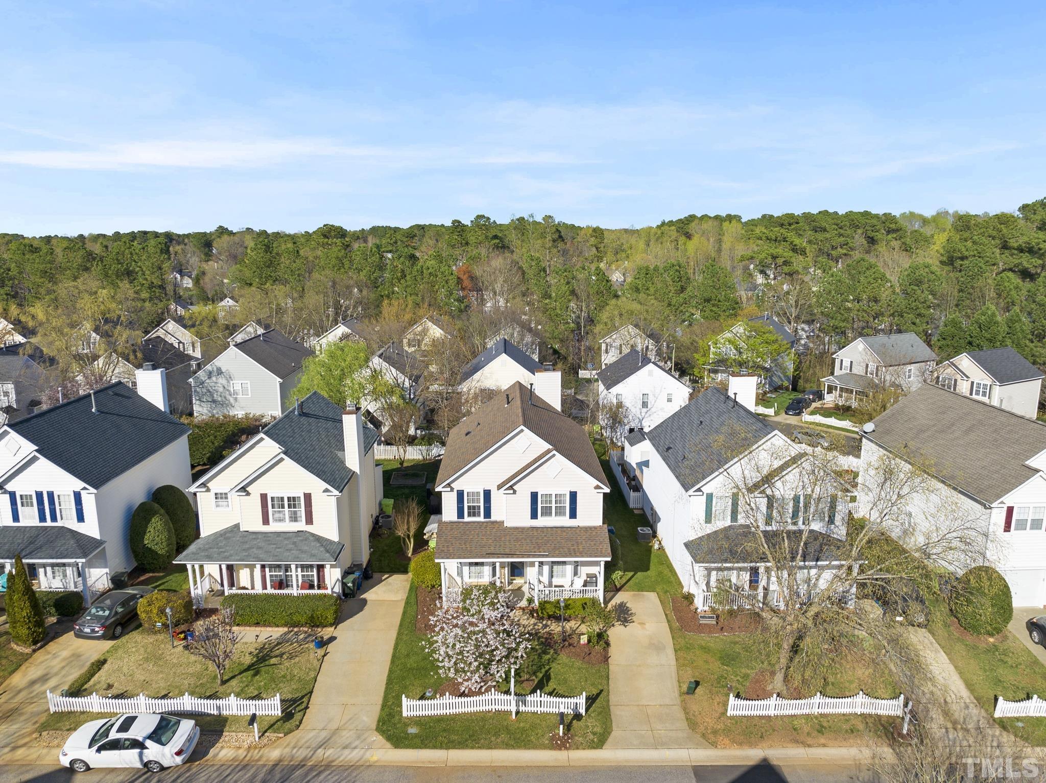 5016 Village Lawn Drive Raleigh, NC 27613 - Photo 2 of 27 a view of a city with tall buildings