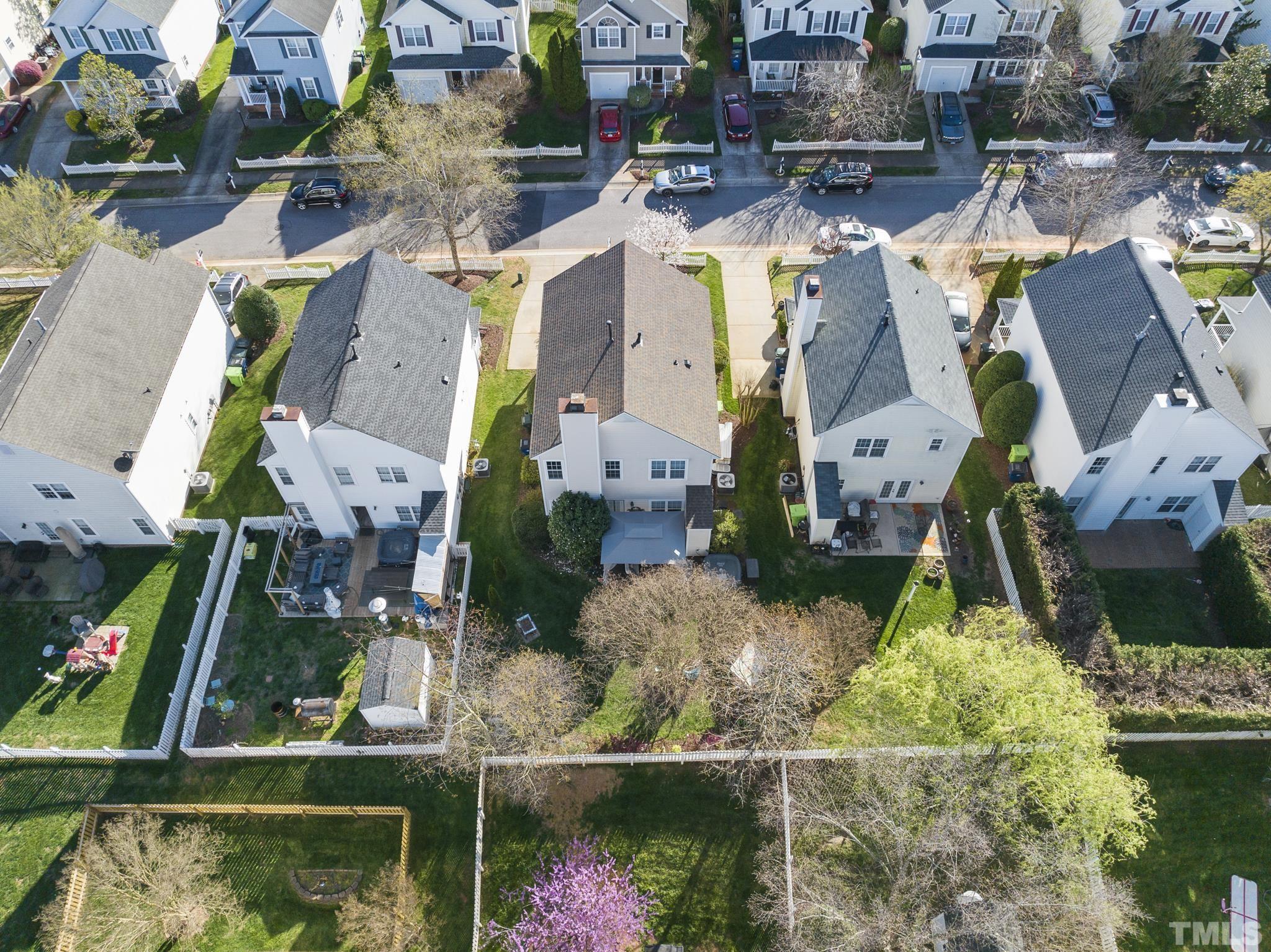 5016 Village Lawn Drive Raleigh, NC 27613 - Photo 25 of 27 an aerial view of residential houses with outdoor space and swimming pool