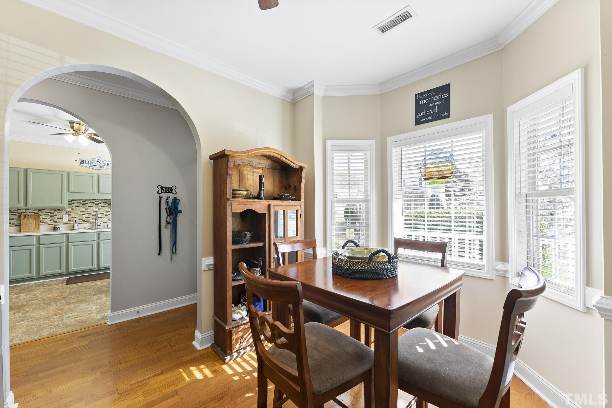 5016 Village Lawn Drive Raleigh, NC 27613 - Photo 3 of 27 a view of a dining room with furniture and a window
