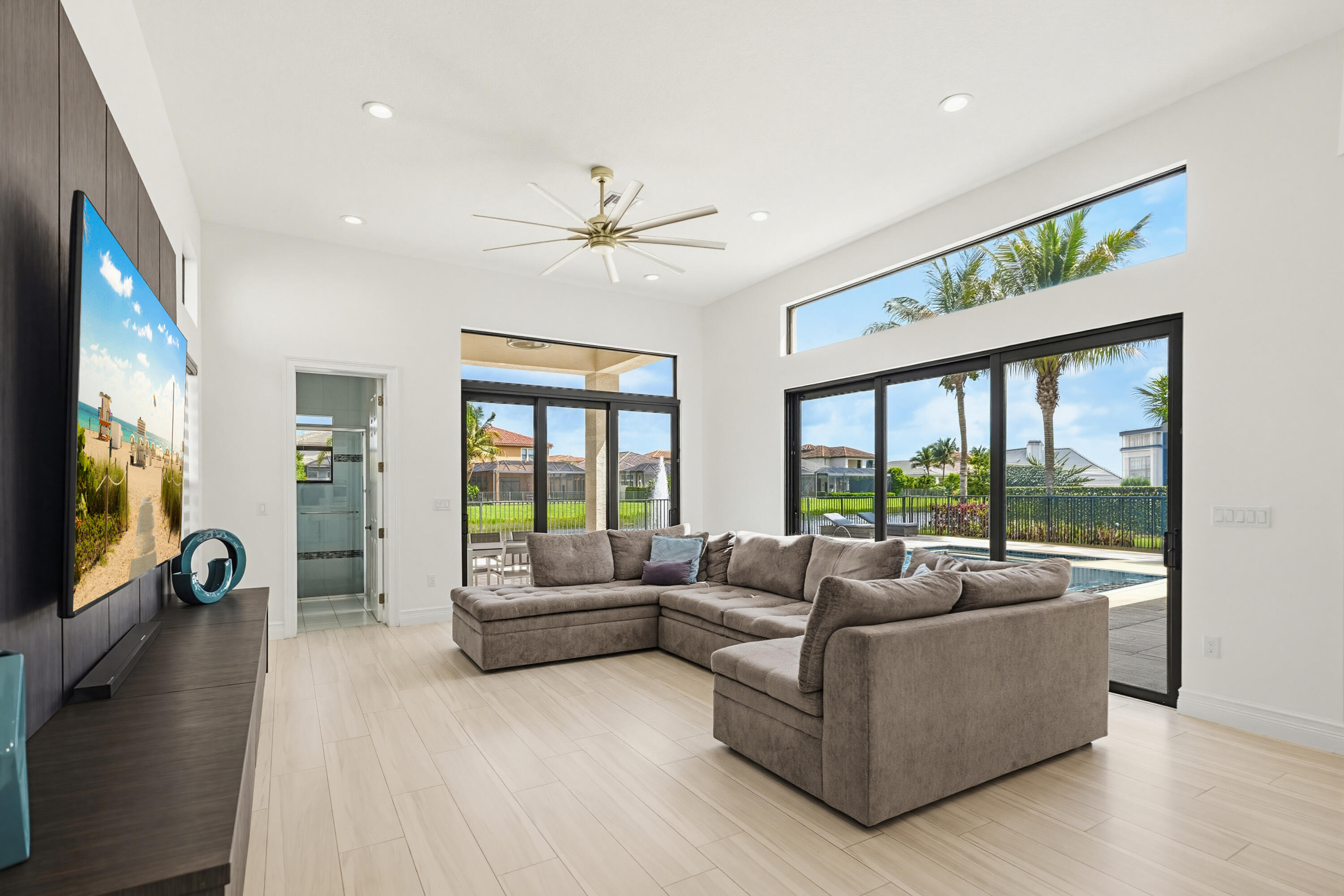 9801 Rennes Lane Delray Beach, FL 33446 - Photo 18 of 77 a living room with furniture and a flat screen tv