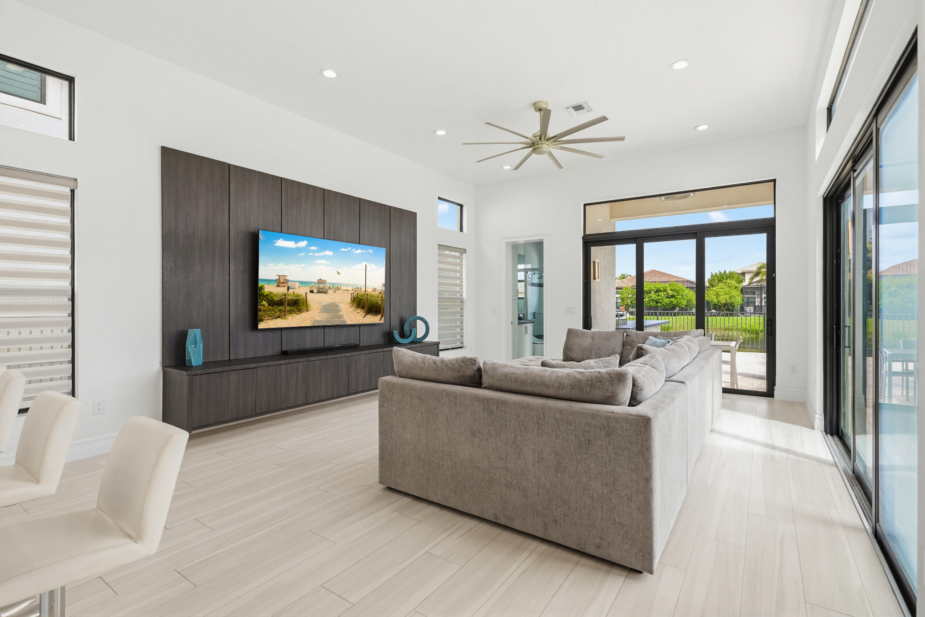 9801 Rennes Lane Delray Beach, FL 33446 - Photo 19 of 77 a living room with furniture and a flat screen tv