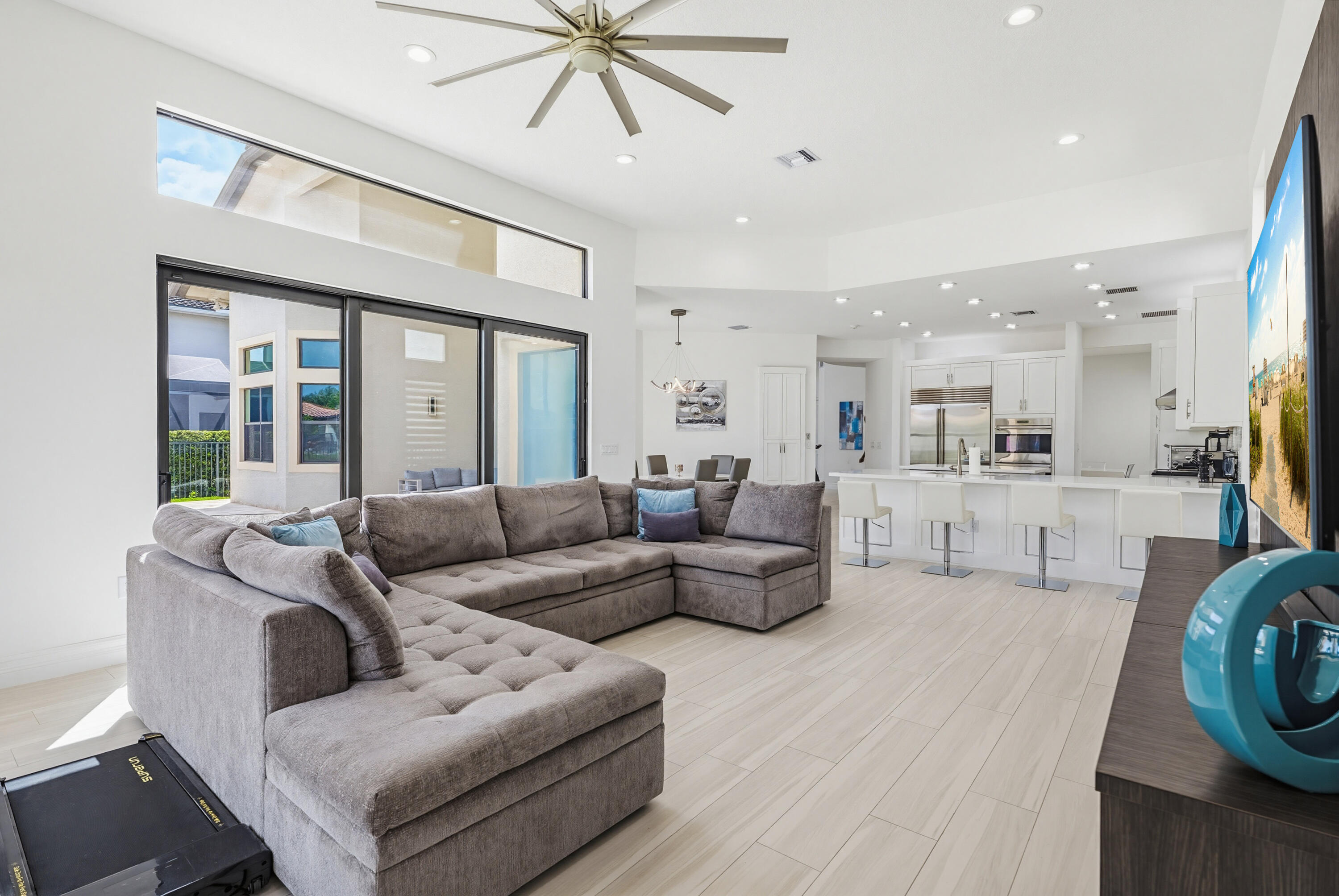 9801 Rennes Lane Delray Beach, FL 33446 - Photo 20 of 77 a living room with furniture and a view of kitchen