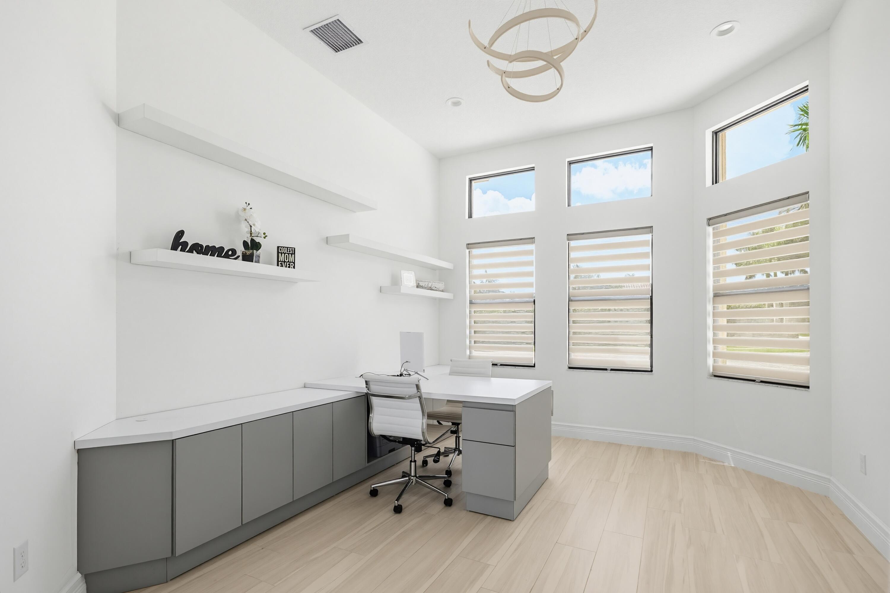 9801 Rennes Lane Delray Beach, FL 33446 - Photo 24 of 77 a view of a workspace with furniture and a window