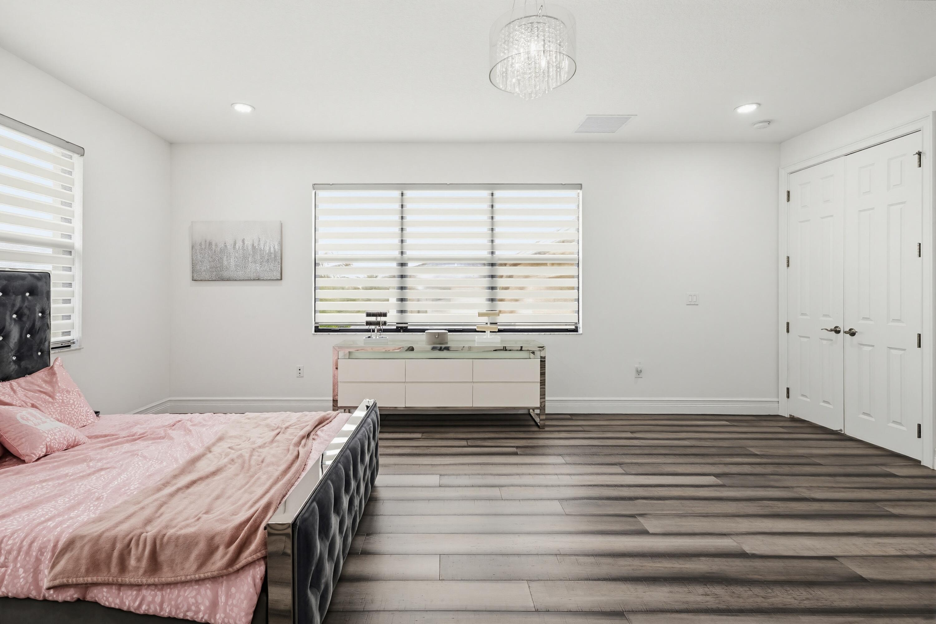 9801 Rennes Lane Delray Beach, FL 33446 - Photo 44 of 77 a room with a bed and a table in it