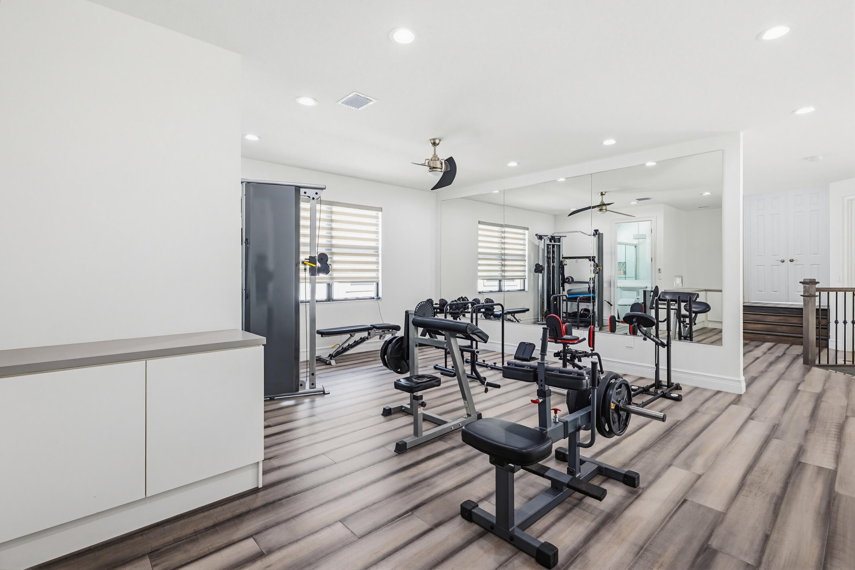 9801 Rennes Lane Delray Beach, FL 33446 - Photo 48 of 77 a view of a dining room with furniture window and wooden floor