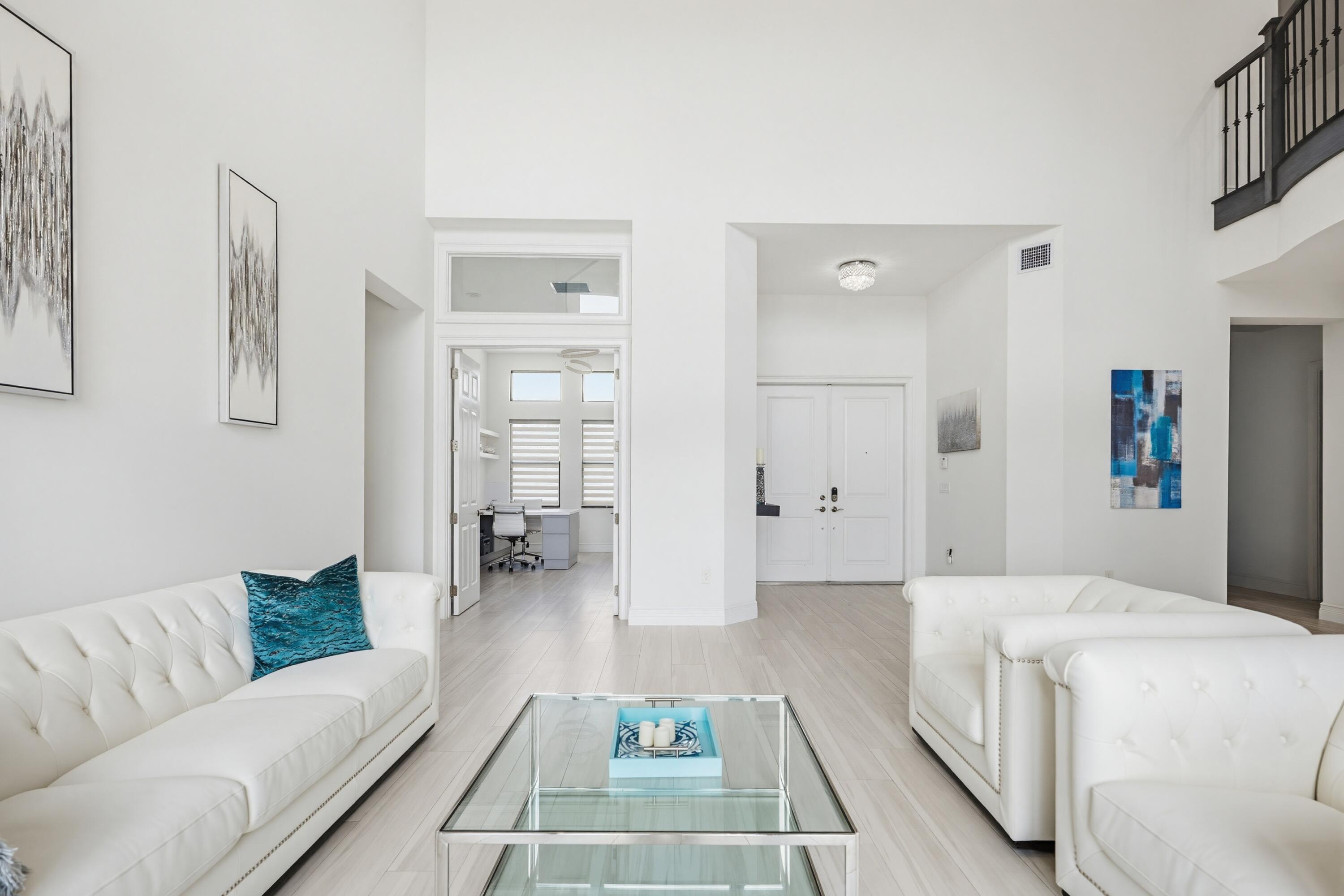 9801 Rennes Lane Delray Beach, FL 33446 - Photo 6 of 77 a living room with furniture and a table