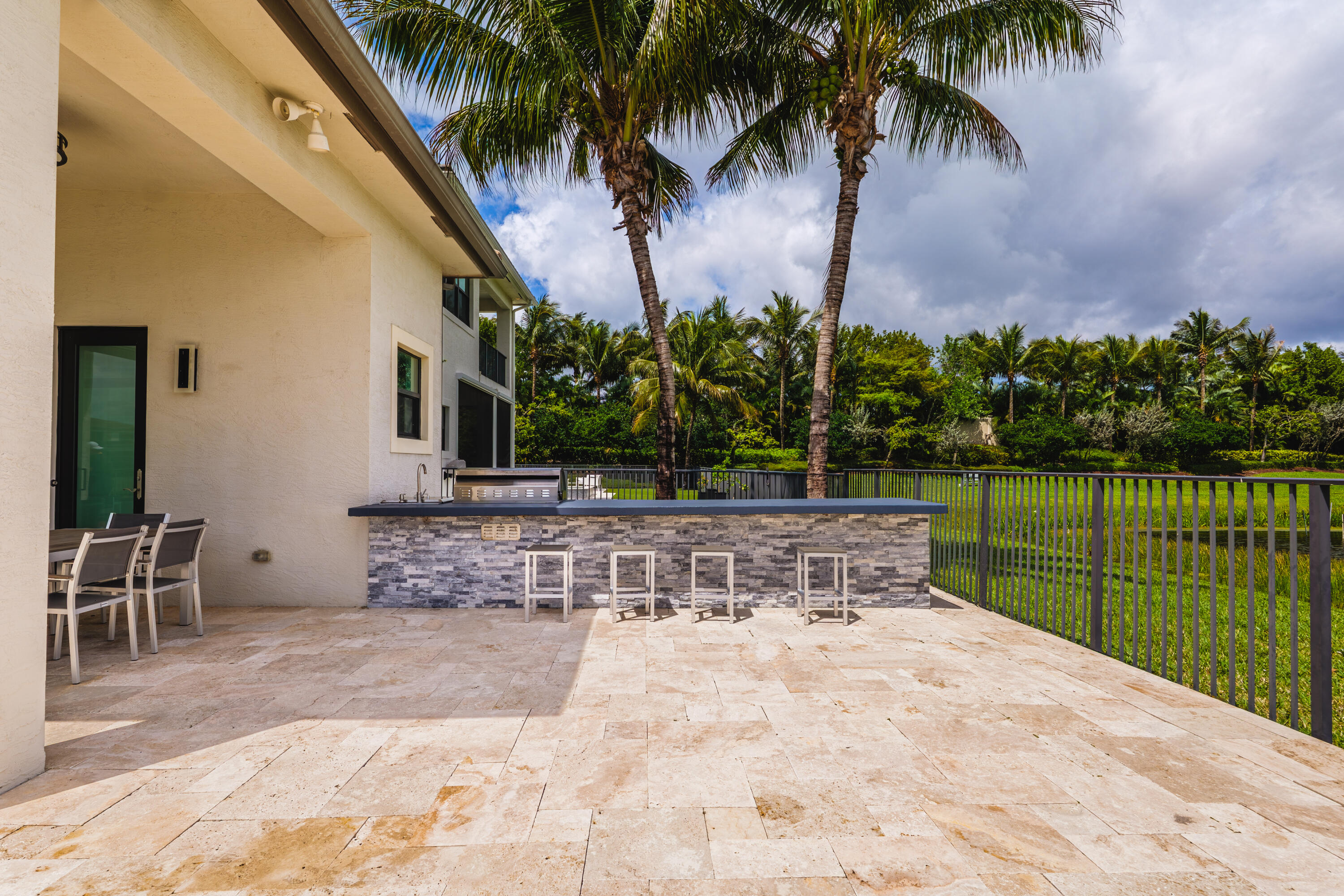 9801 Rennes Lane Delray Beach, FL 33446 - Photo 68 of 77 a view of a backyard with a patio