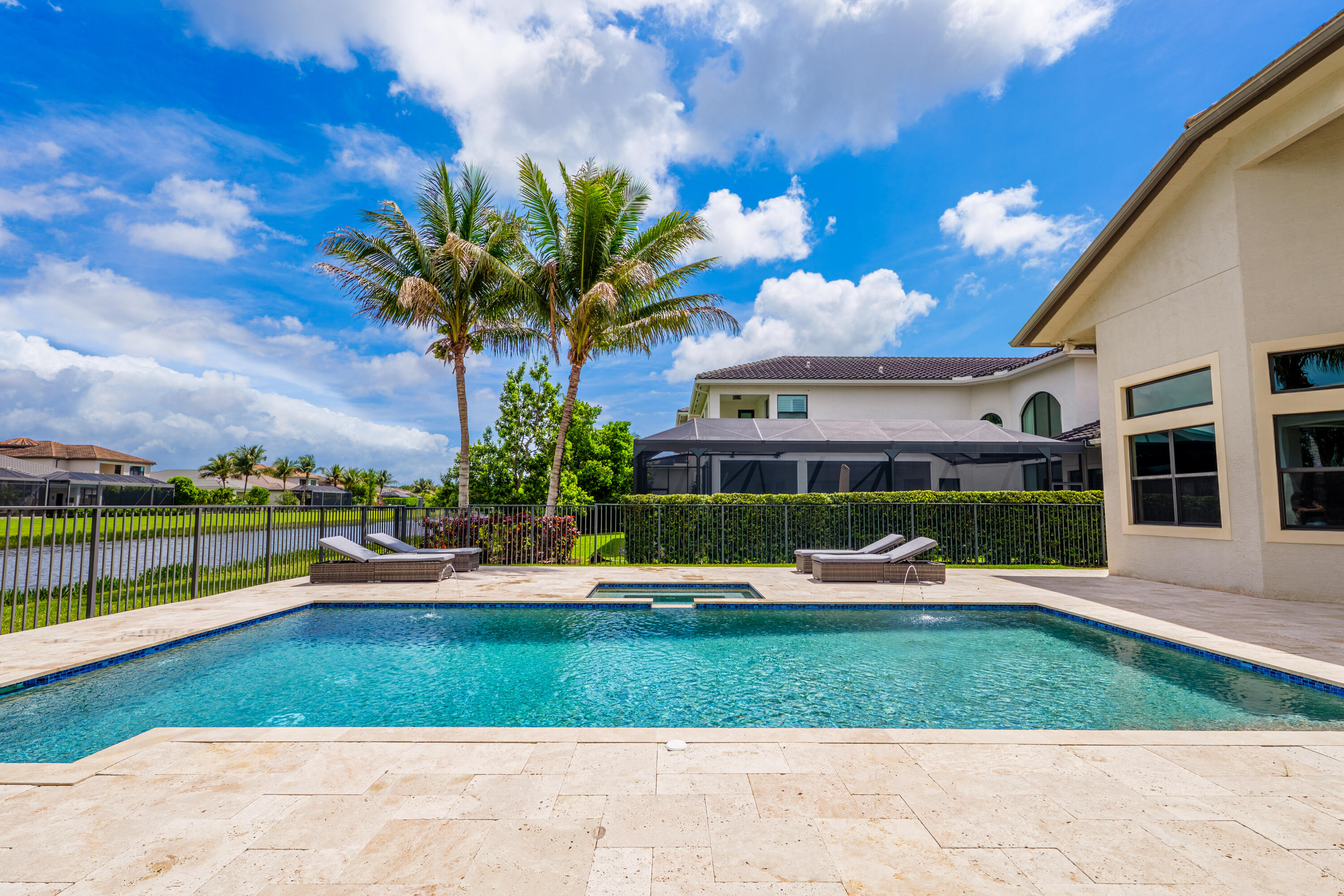9801 Rennes Lane Delray Beach, FL 33446 - Photo 72 of 77 a front view of a house with a garden and plants
