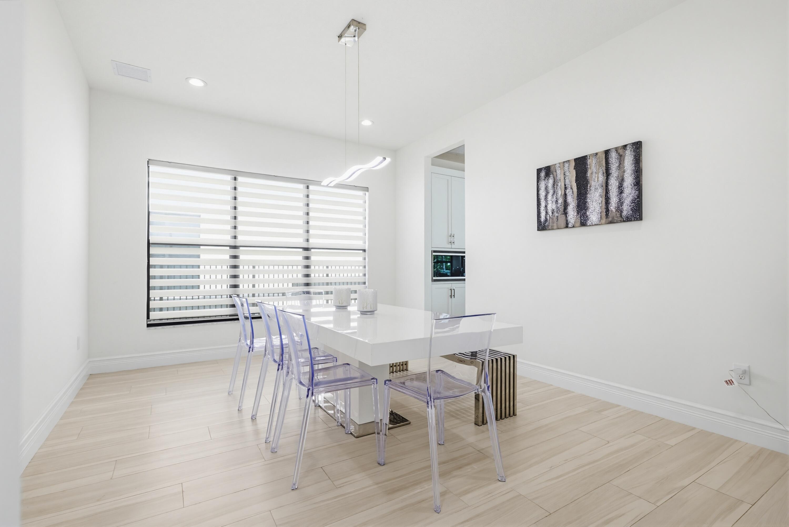 9801 Rennes Lane Delray Beach, FL 33446 - Photo 10 of 77 a view of a dining room with furniture and window