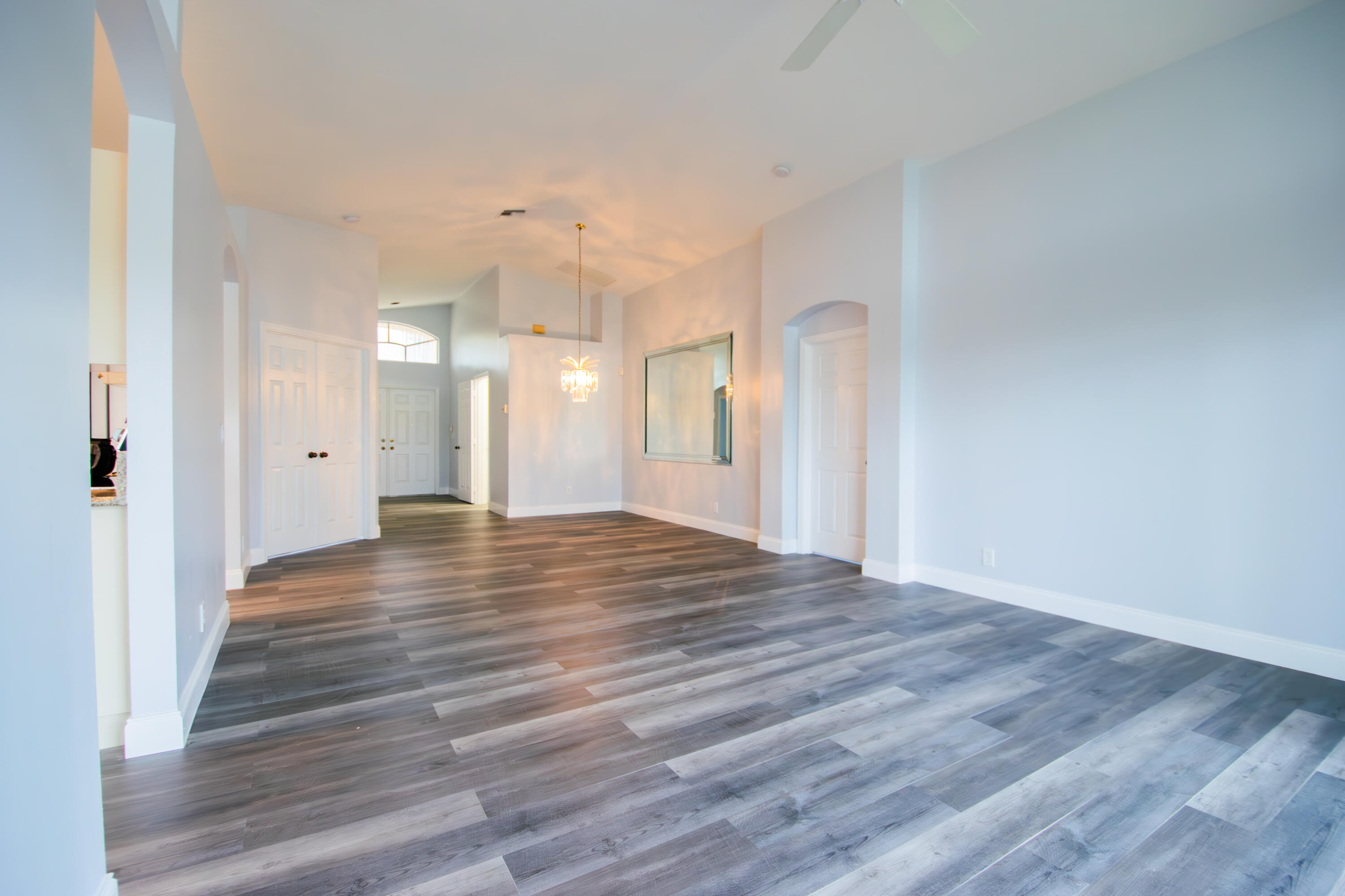 7243 Modena Drive Boynton Beach, FL 33437 - Photo 17 of 28 a view of an empty room and wooden floor