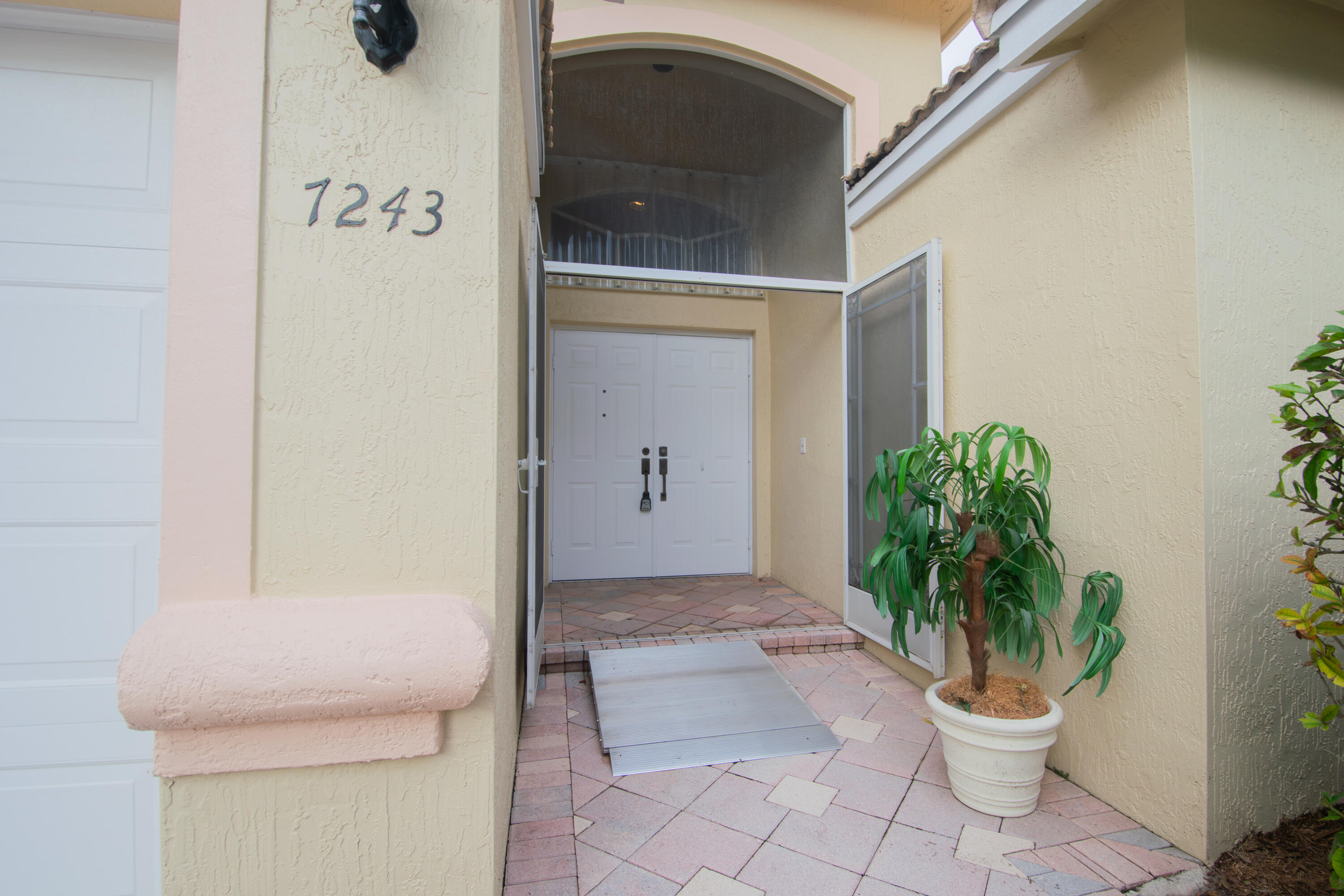 7243 Modena Drive Boynton Beach, FL 33437 - Photo 2 of 28 a porch with a toilet