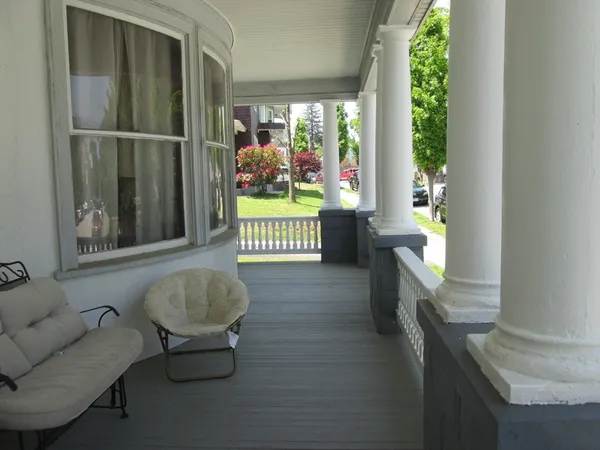 a living room with furniture and a gate