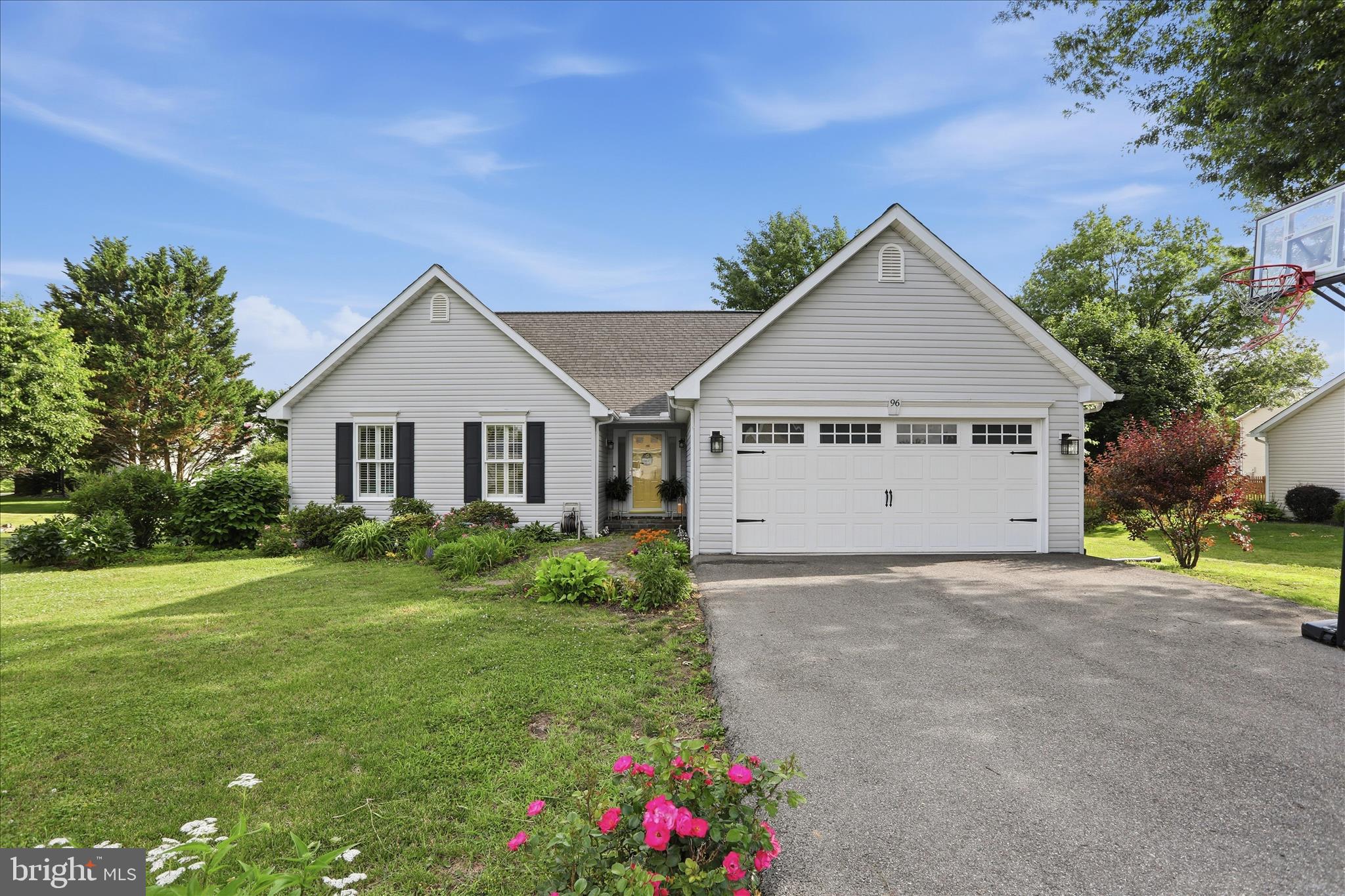 96 Phoenix Lane Falling Waters, WV 25419 - Photo 2 of 37 a view of a house with a yard and garage