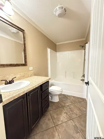 a bathroom with a sink a toilet and bathtub
