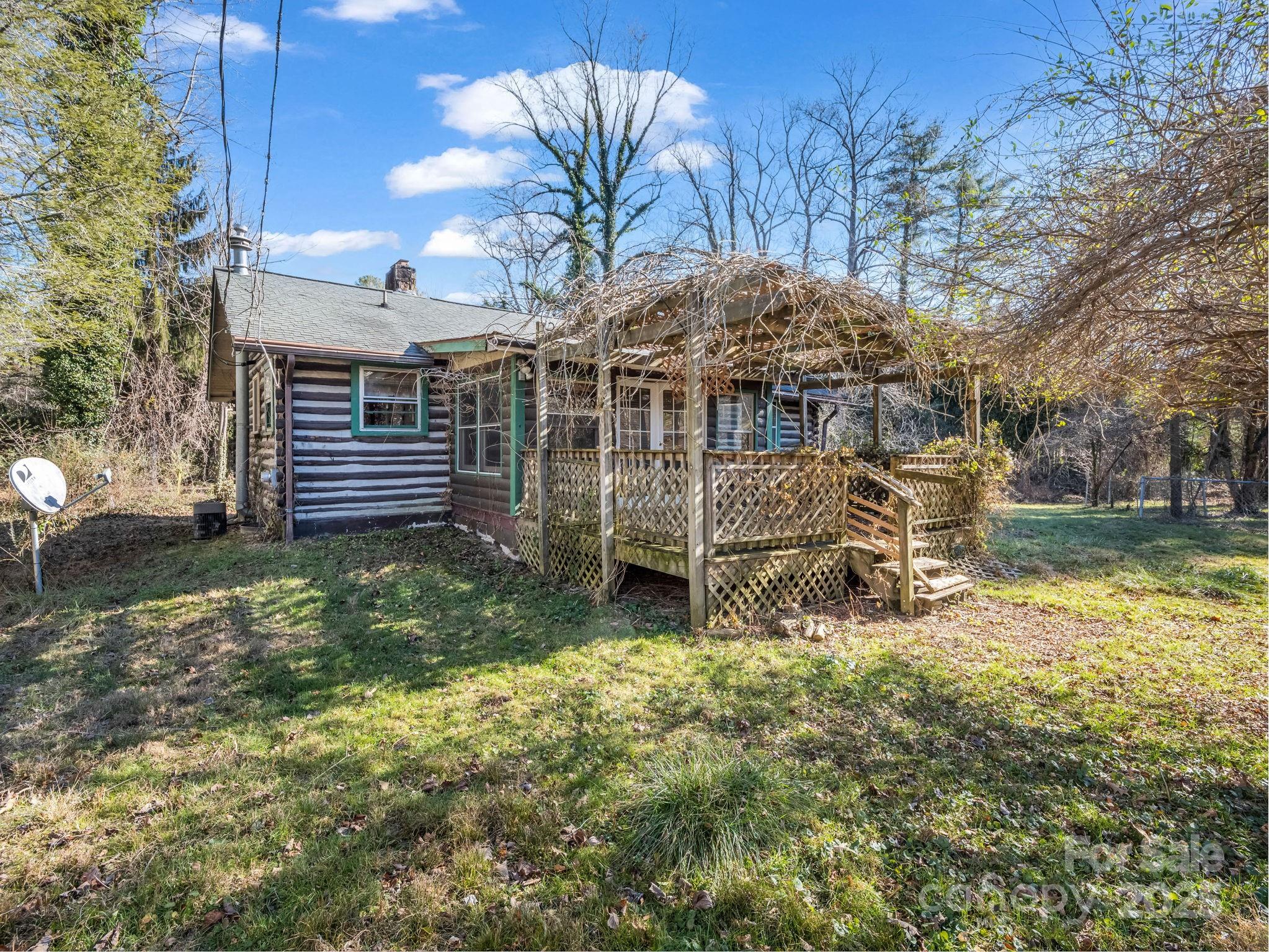541 Broadway Street Hendersonville, NC 28739 - Photo 6 of 37 a view of a house with a yard porch and sitting area