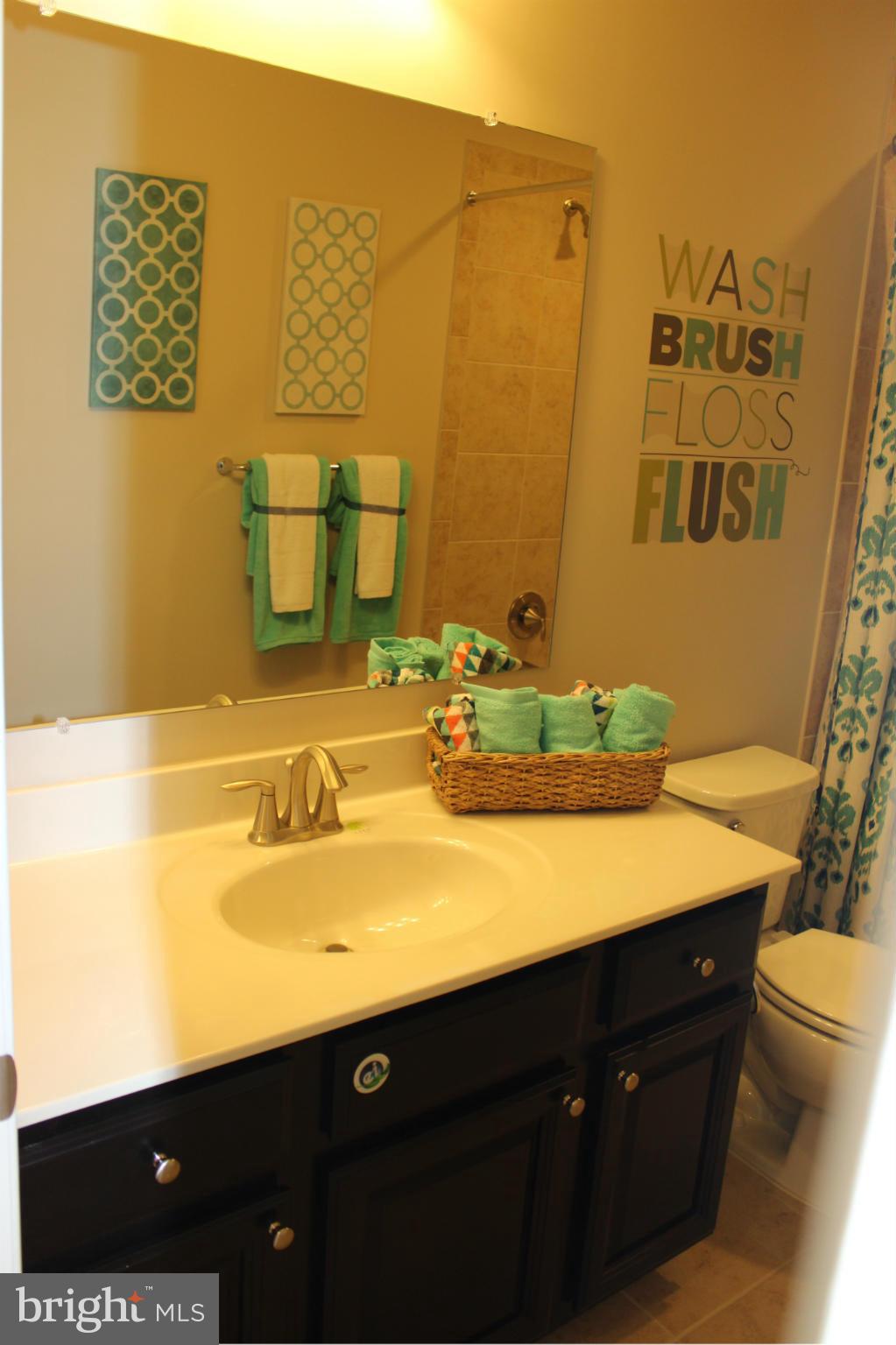1012 Red Clover Road Gambrills, MD 21054 - Photo 15 of 30 a bathroom with a sink vanity and toilet