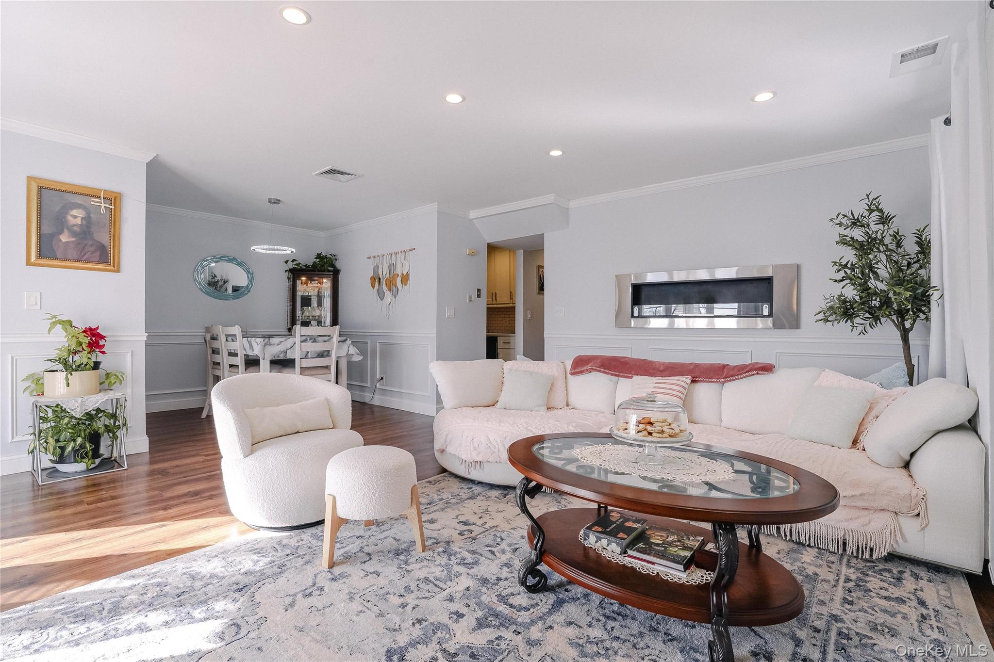 37 Harbor Lane, Unit 2C New Rochelle, NY 10805 - Photo 2 of 17 a living room with furniture and a table