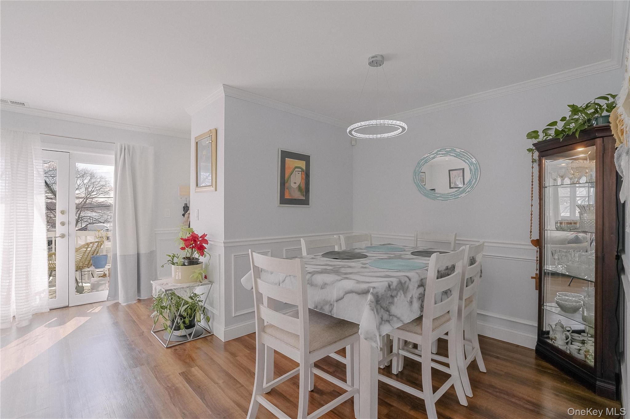 37 Harbor Lane, Unit 2C New Rochelle, NY 10805 - Photo 4 of 17 a view of a dining room with furniture and wooden floor