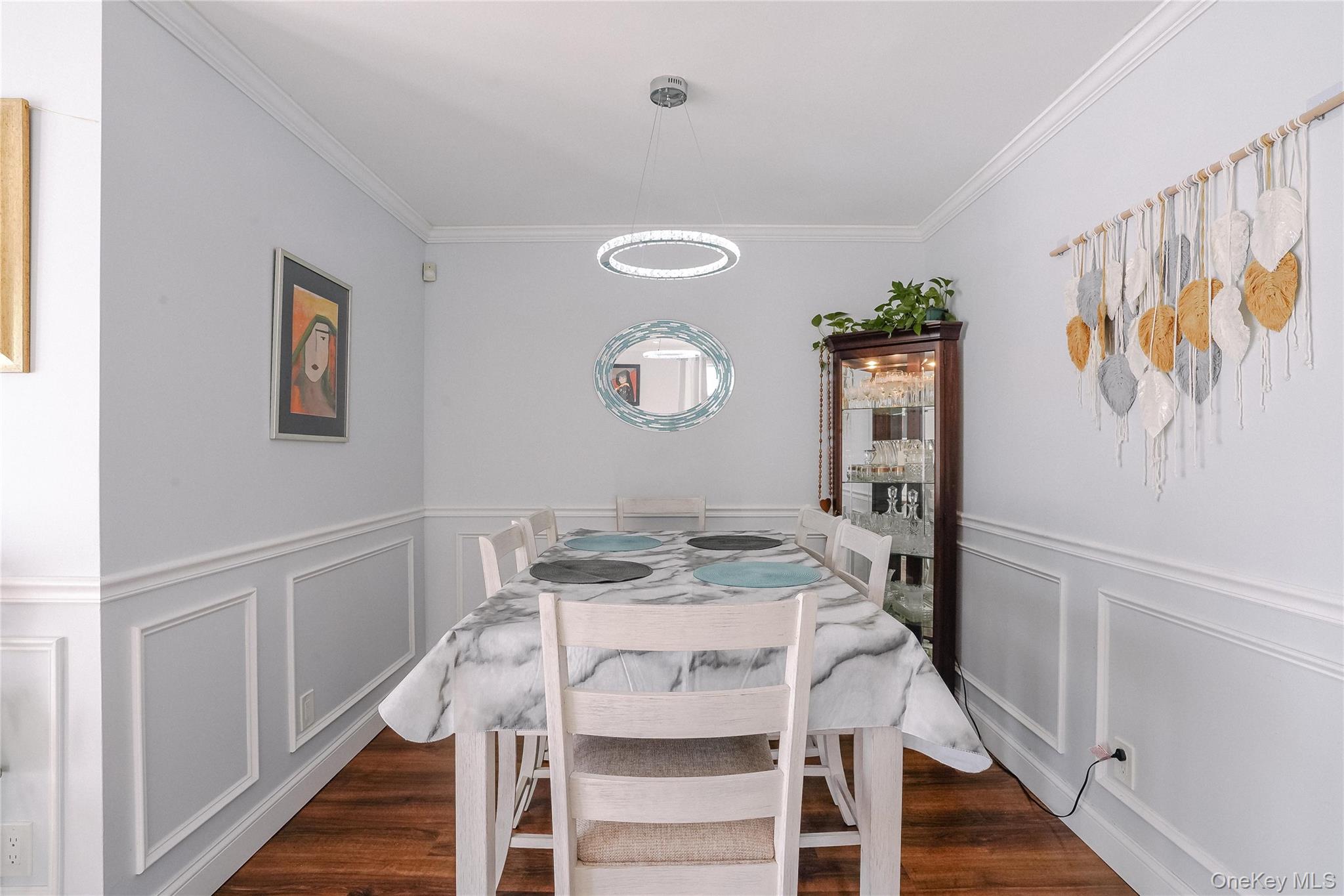 37 Harbor Lane, Unit 2C New Rochelle, NY 10805 - Photo 5 of 17 a view of a dining room with furniture and wooden floor
