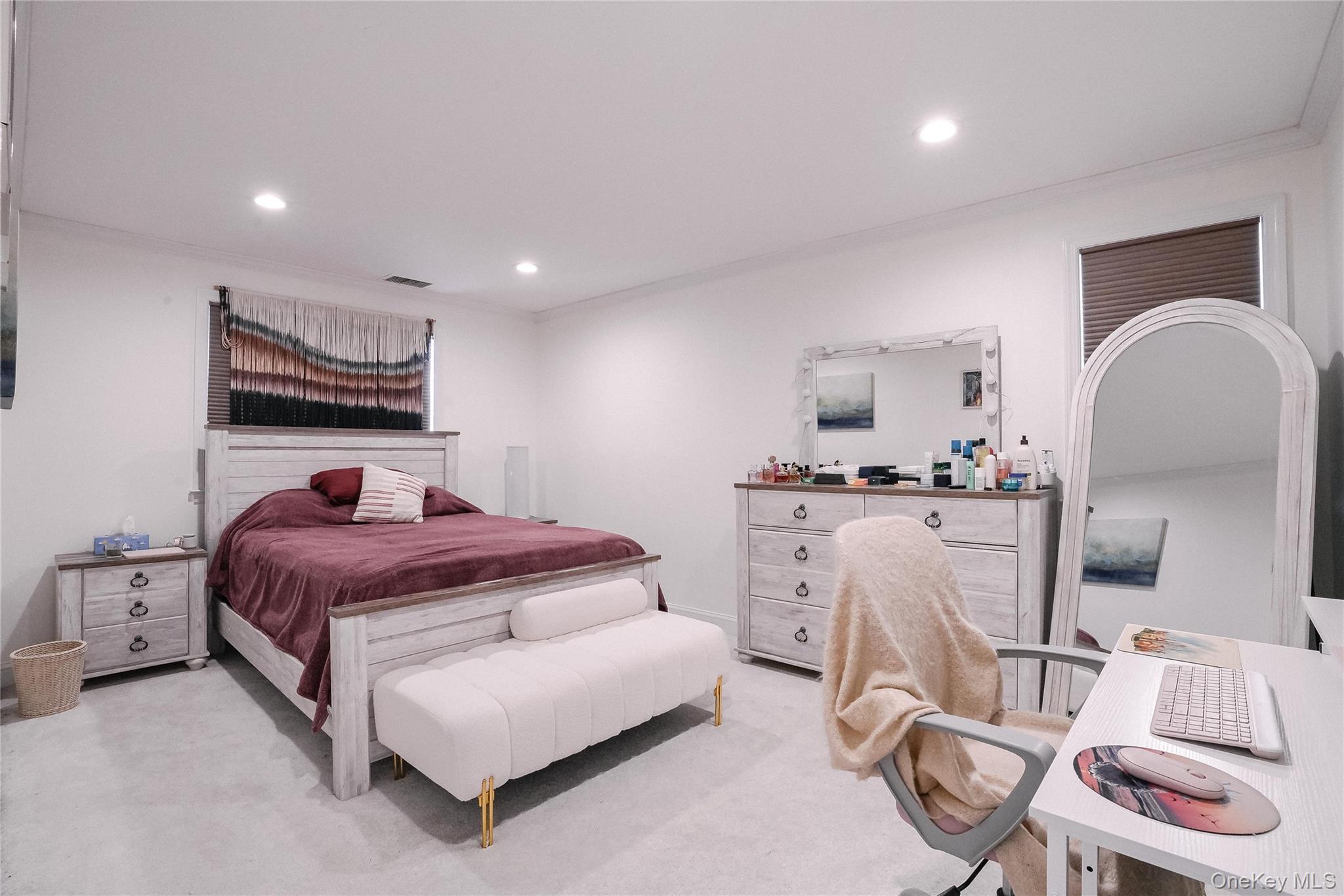 37 Harbor Lane, Unit 2C New Rochelle, NY 10805 - Photo 10 of 17 a bed room with furniture and a mirror