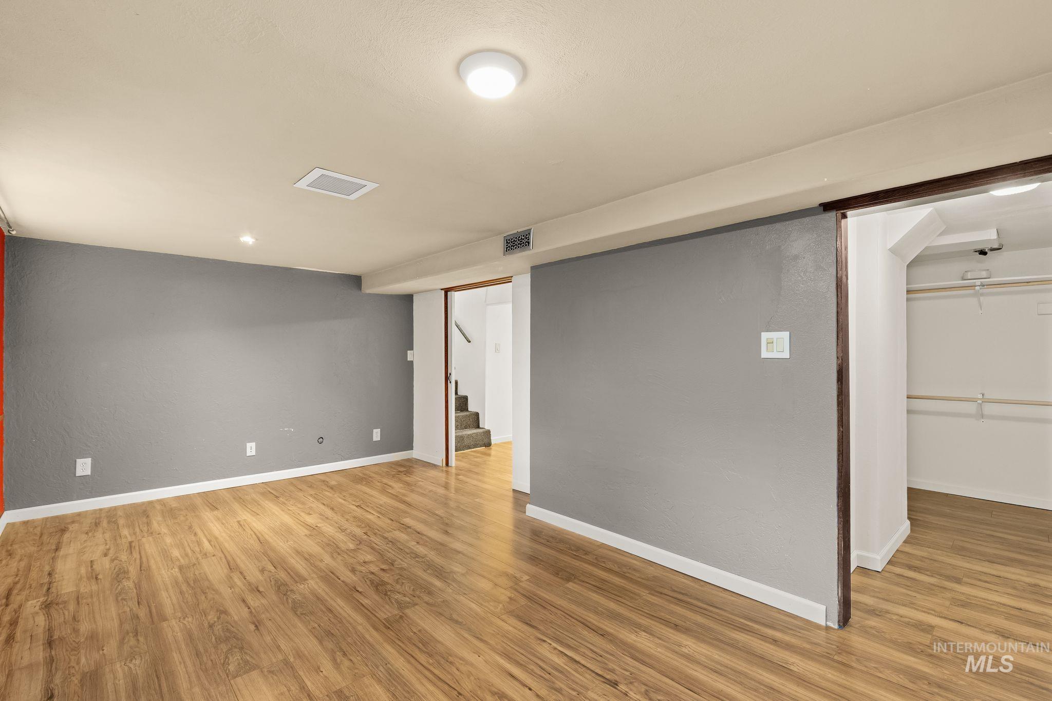 928 3rd Street Clarkston, WA 99403 - Photo 31 of 44 Spacious room featuring wood-finish flooring, recessed lighting, and a neutral color palette
