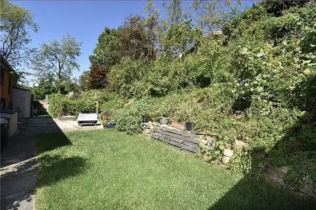 a view of a backyard with seating area
