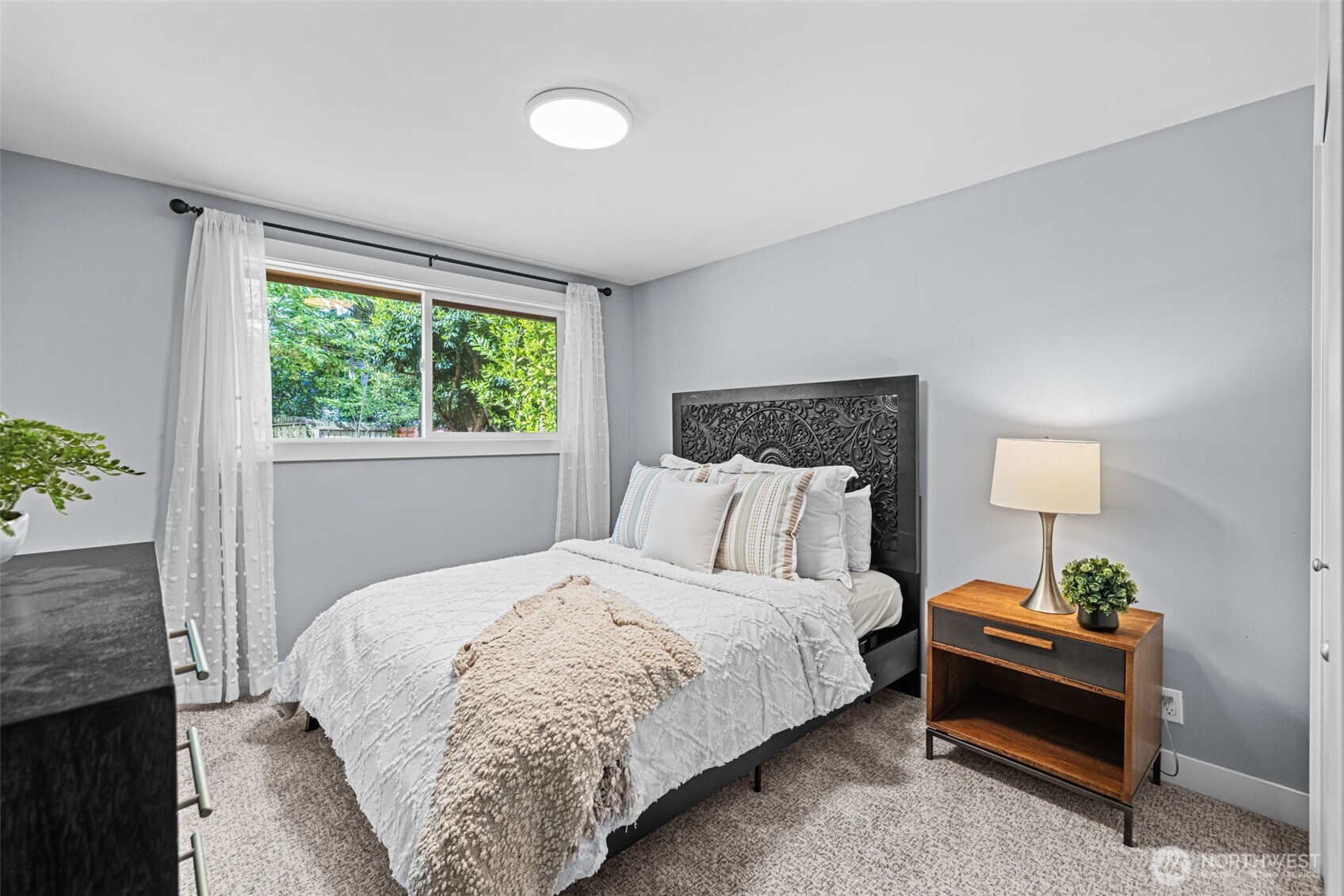 8629 223rd Street Southwest Edmonds, WA 98026 - Photo 16 of 40 a bedroom with a bed and a night stand
