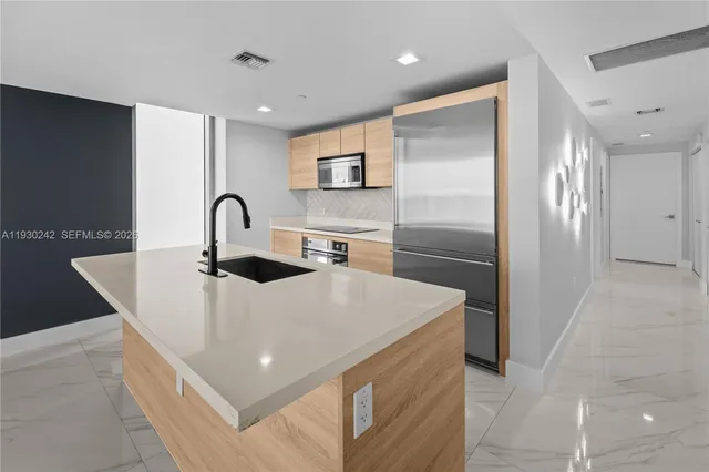 a spacious bathroom with a double vanity sink a and a mirror