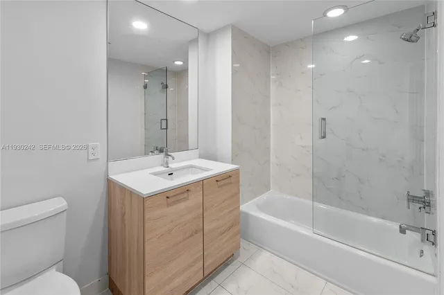 a view of a hallway with washer and dryer
