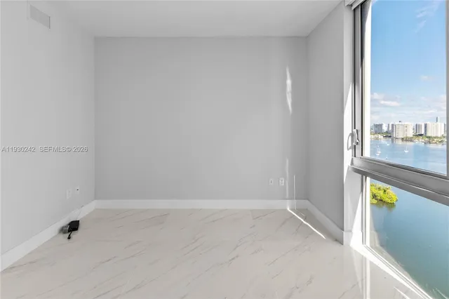 a view of a hallway with paintings on the wall