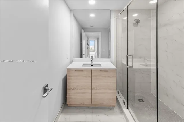 a view of a room with gym equipment and a large window