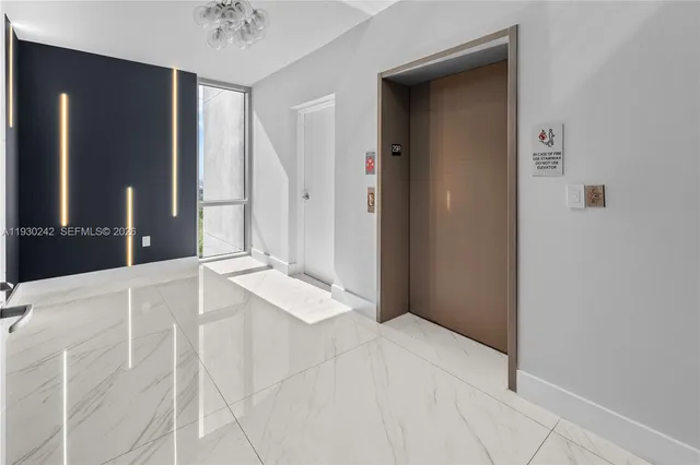 a view of lobby with furniture and floor to ceiling window