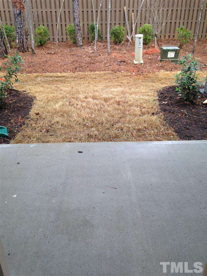 690 Wickham Ridge Road, Unit 141 Apex, NC 27539 - Photo 12 of 25 a view of a backyard of a house