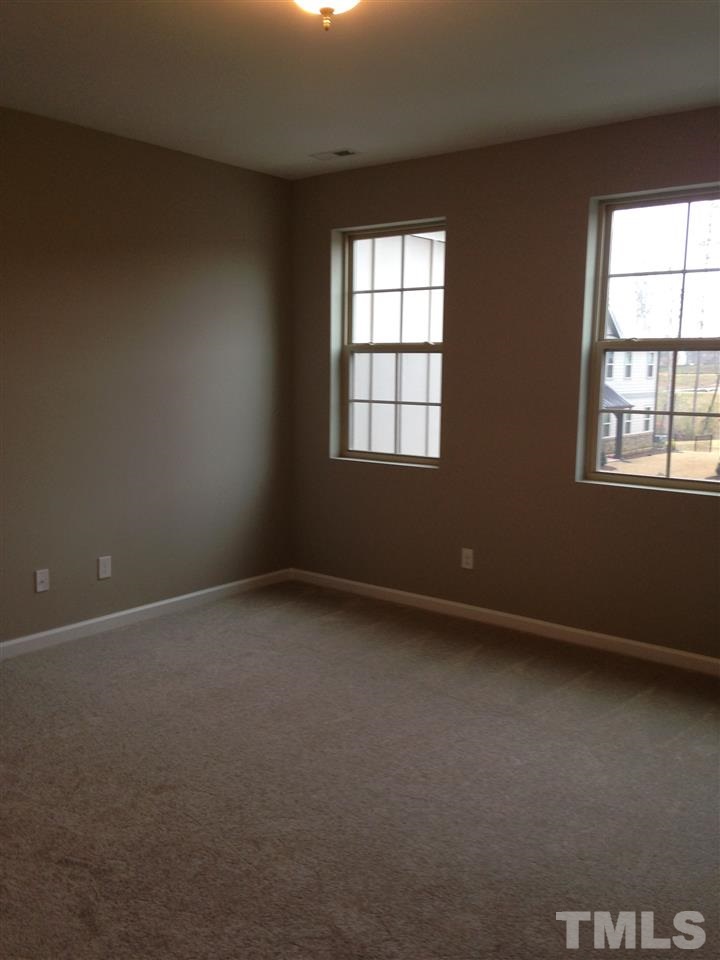 690 Wickham Ridge Road, Unit 141 Apex, NC 27539 - Photo 14 of 25 an empty room with a window