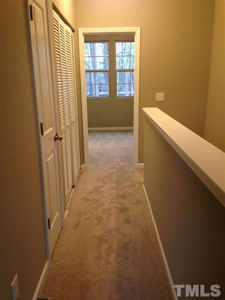 690 Wickham Ridge Road, Unit 141 Apex, NC 27539 - Photo 18 of 25 a view of hallway with windows