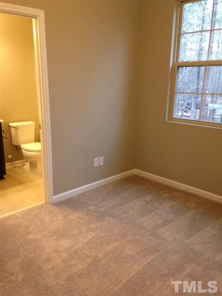 690 Wickham Ridge Road, Unit 141 Apex, NC 27539 - Photo 20 of 25 an empty room and a window
