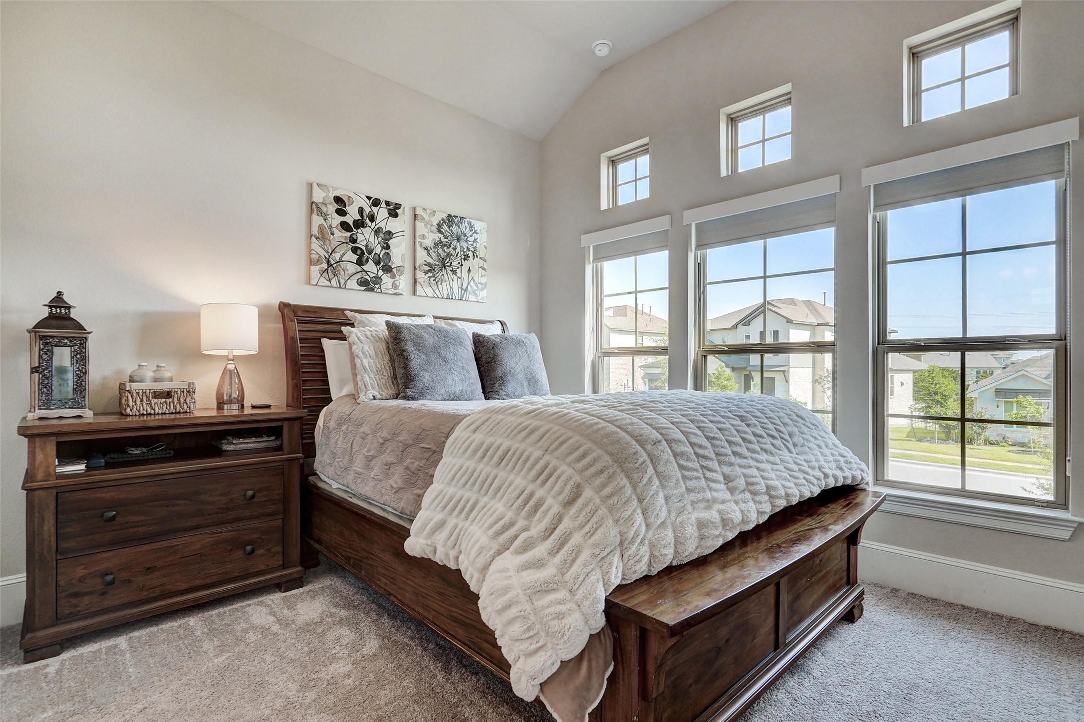 720 Rawson Bend Austin, TX 78738 - Photo 18 of 39 a bed sitting in a bedroom next to a window