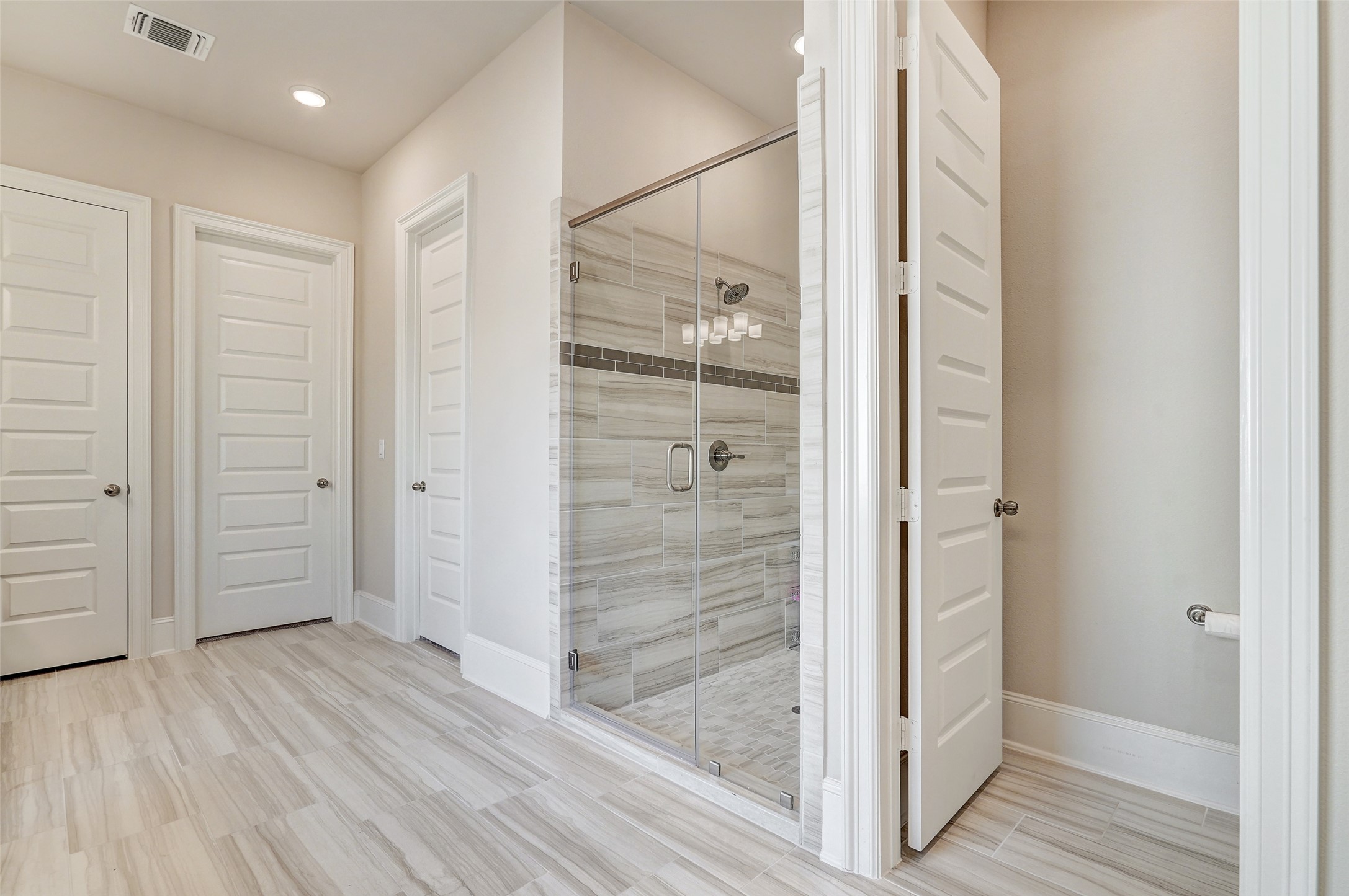 720 Rawson Bend Austin, TX 78738 - Photo 18 of 40 Bathroom featuring a stall shower, wood finish floors, and recessed lighting