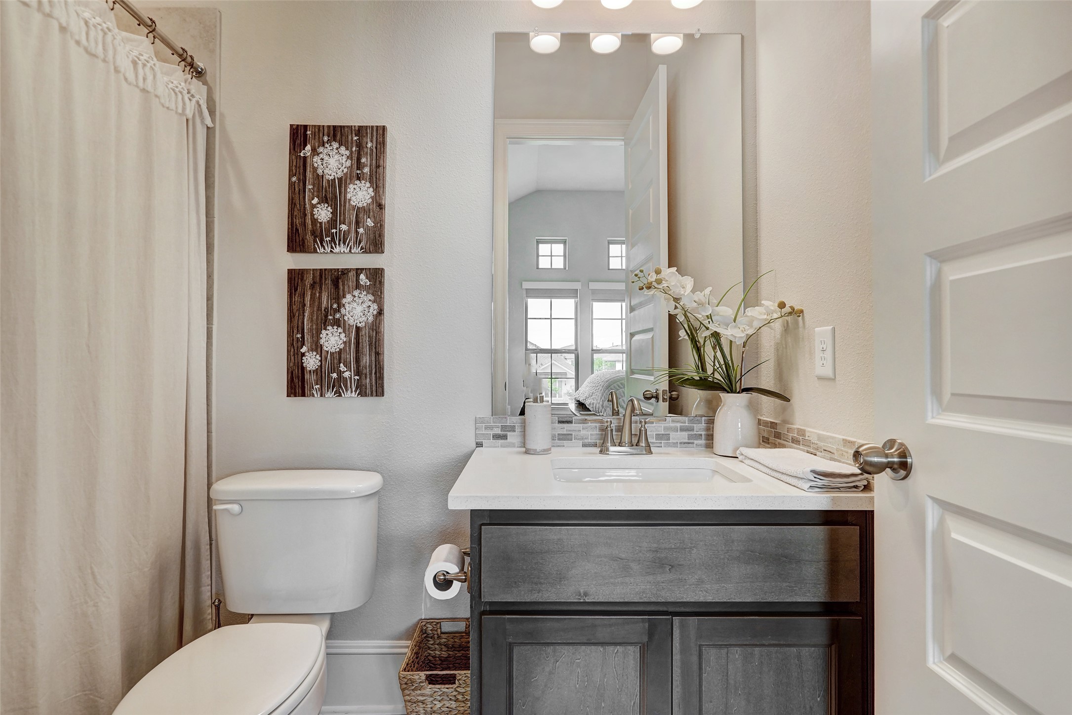 720 Rawson Bend Austin, TX 78738 - Photo 20 of 39 a bathroom with a sink toilet and a mirror
