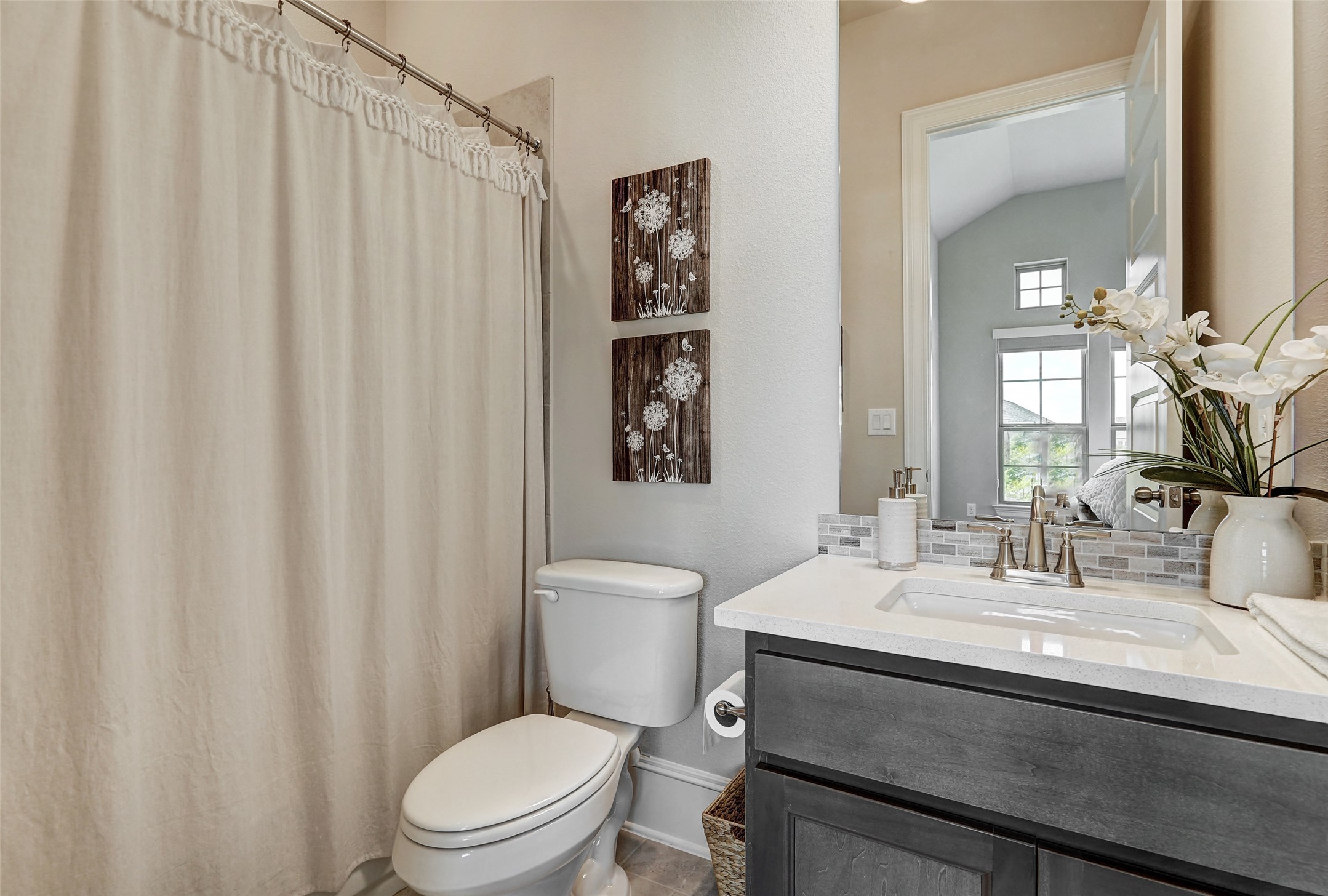 720 Rawson Bend Austin, TX 78738 - Photo 21 of 39 a bathroom with a sink a toilet and shower curtain