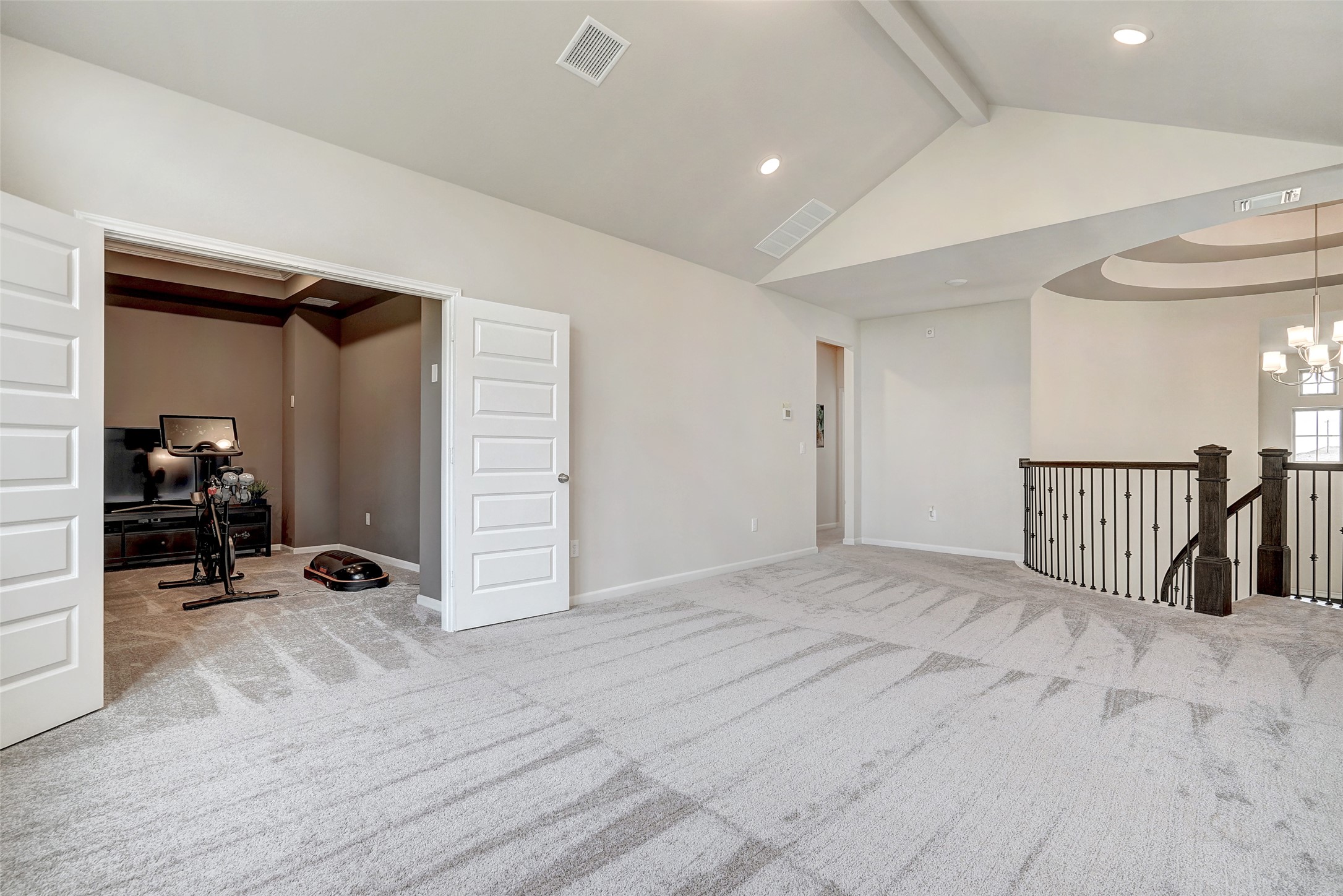 720 Rawson Bend Austin, TX 78738 - Photo 28 of 40 Carpeted spare room featuring a chandelier and recessed lighting