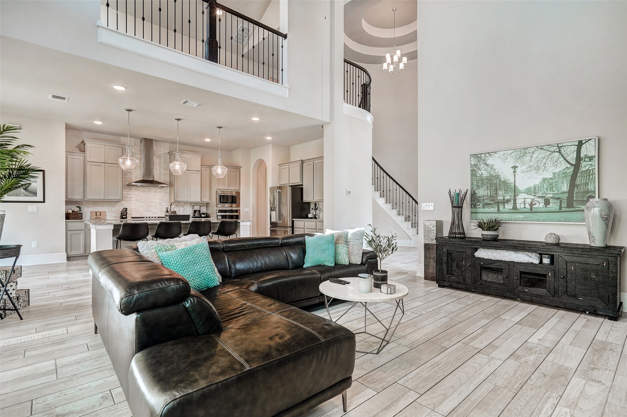 720 Rawson Bend Austin, TX 78738 - Photo 8 of 39 a living room with furniture kitchen view and a wooden floor