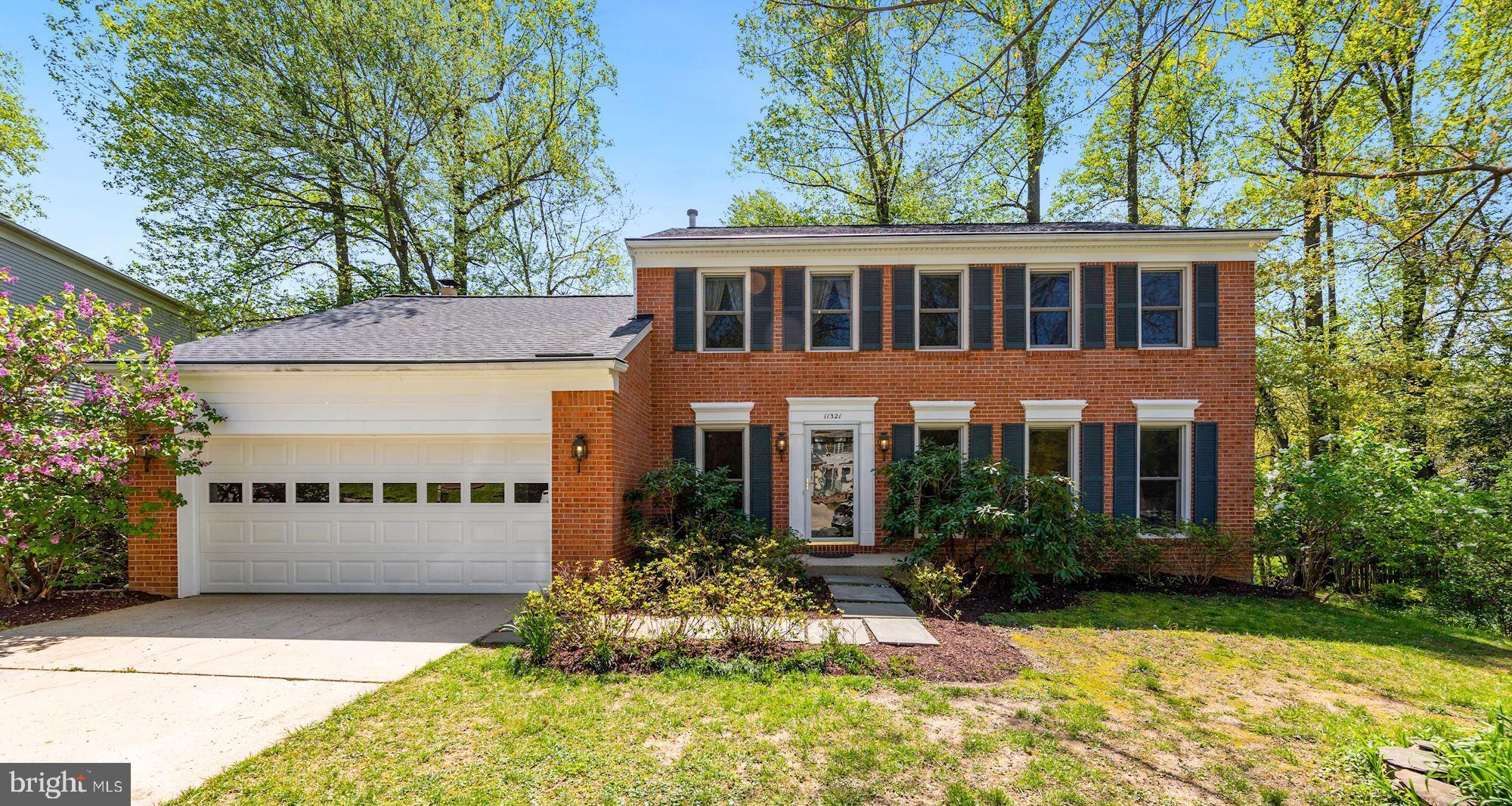a front view of a building with garden