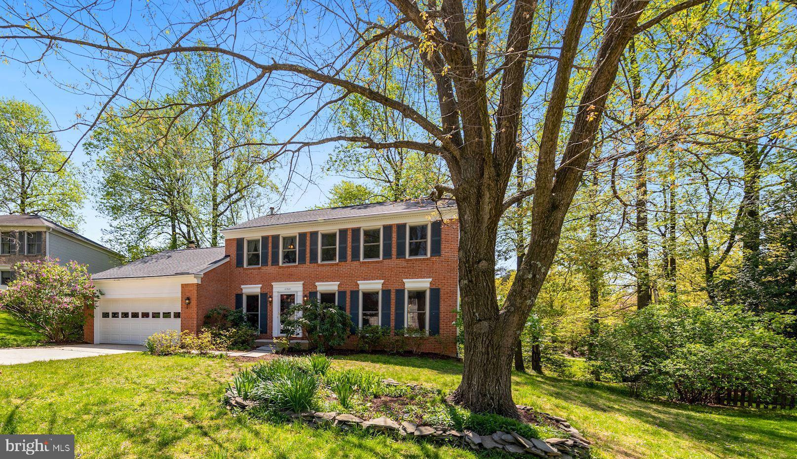 11321 Classical Lane Silver Spring, MD 20901 - Photo 2 of 35 a front view of a house with yard and green space
