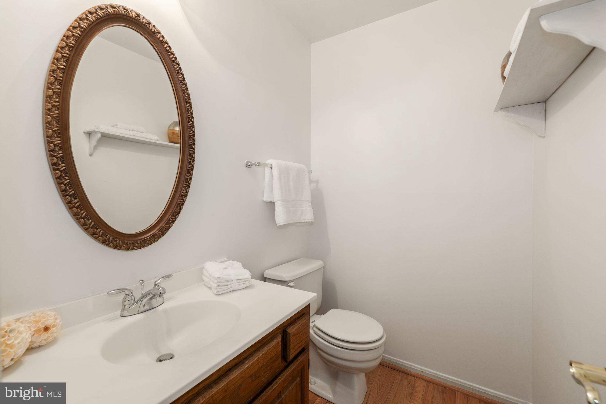 11321 Classical Lane Silver Spring, MD 20901 - Photo 14 of 35 a bathroom with a sink and a mirror
