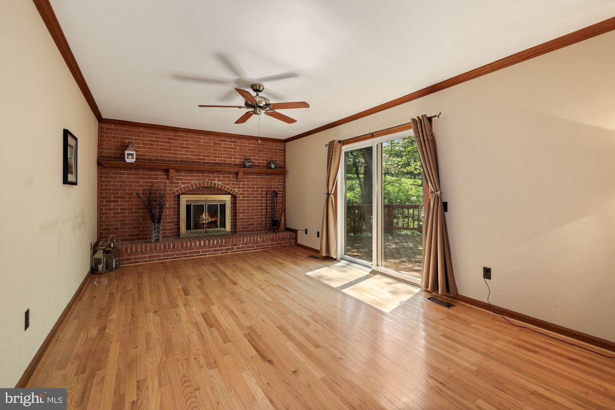 11321 Classical Lane Silver Spring, MD 20901 - Photo 15 of 35 a view of empty room with wooden floor and fan