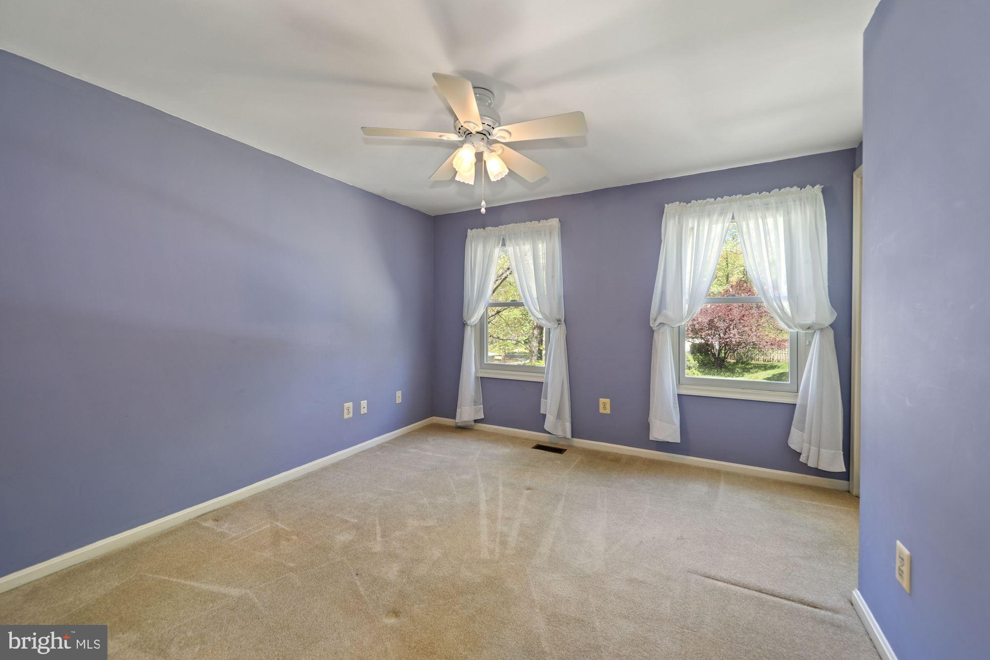 11321 Classical Lane Silver Spring, MD 20901 - Photo 19 of 35 an empty room with windows and fan