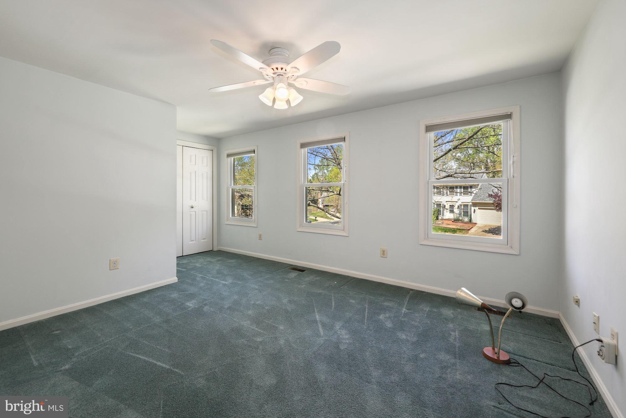 11321 Classical Lane Silver Spring, MD 20901 - Photo 20 of 35 an empty room with windows and fan