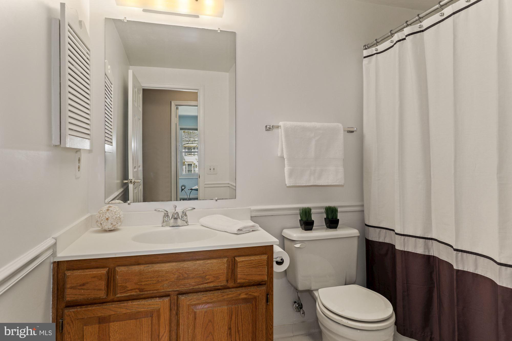 11321 Classical Lane Silver Spring, MD 20901 - Photo 25 of 35 a bathroom with a sink toilet and shower